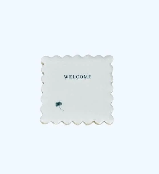 Single welcome cookie close-up with printed text