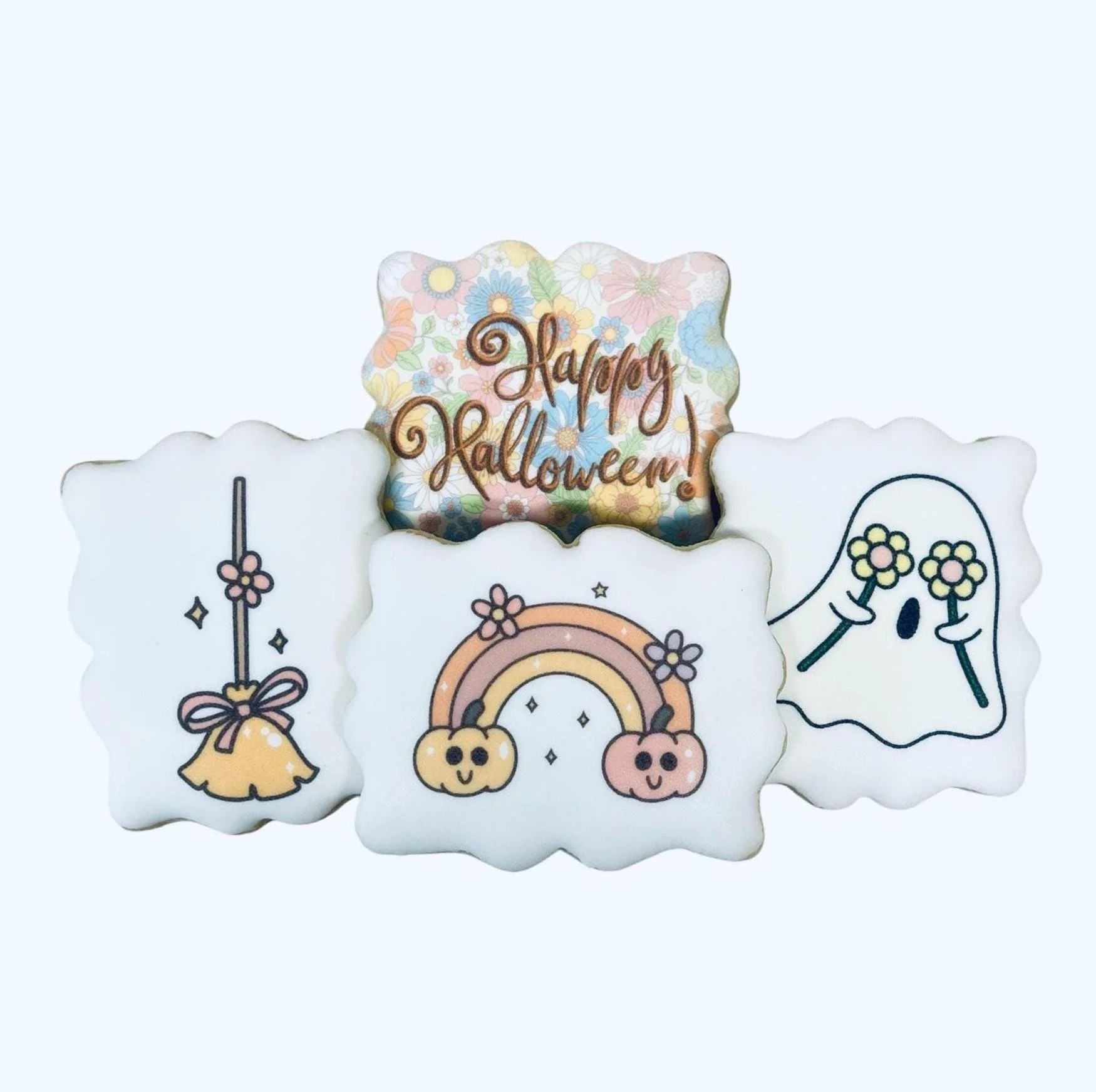 Pastel Halloween cookies with ghost and rainbow motifs