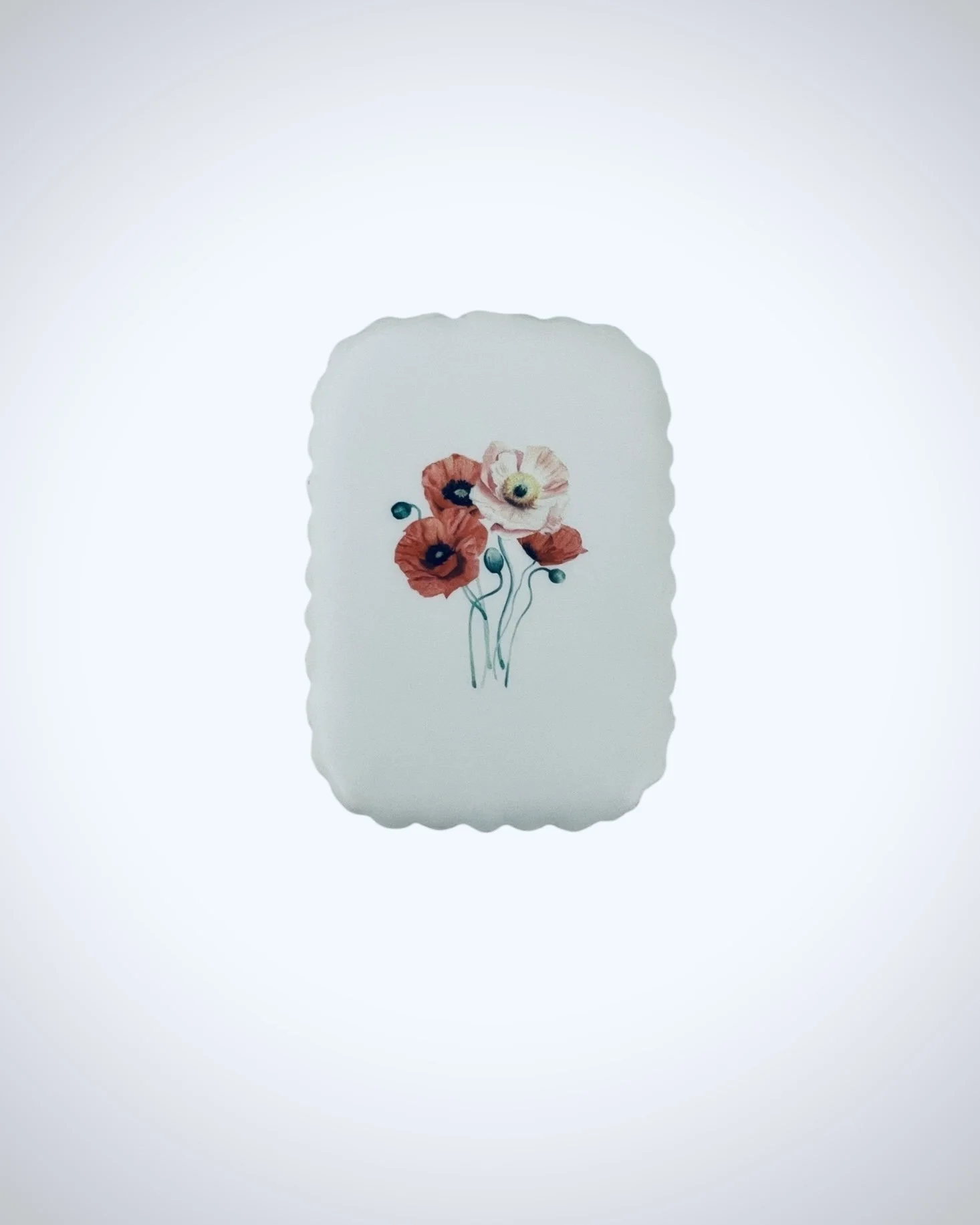 iced sugar cookie printed with red poppy botanical artwork using edible ink, minimalist floral cookie design