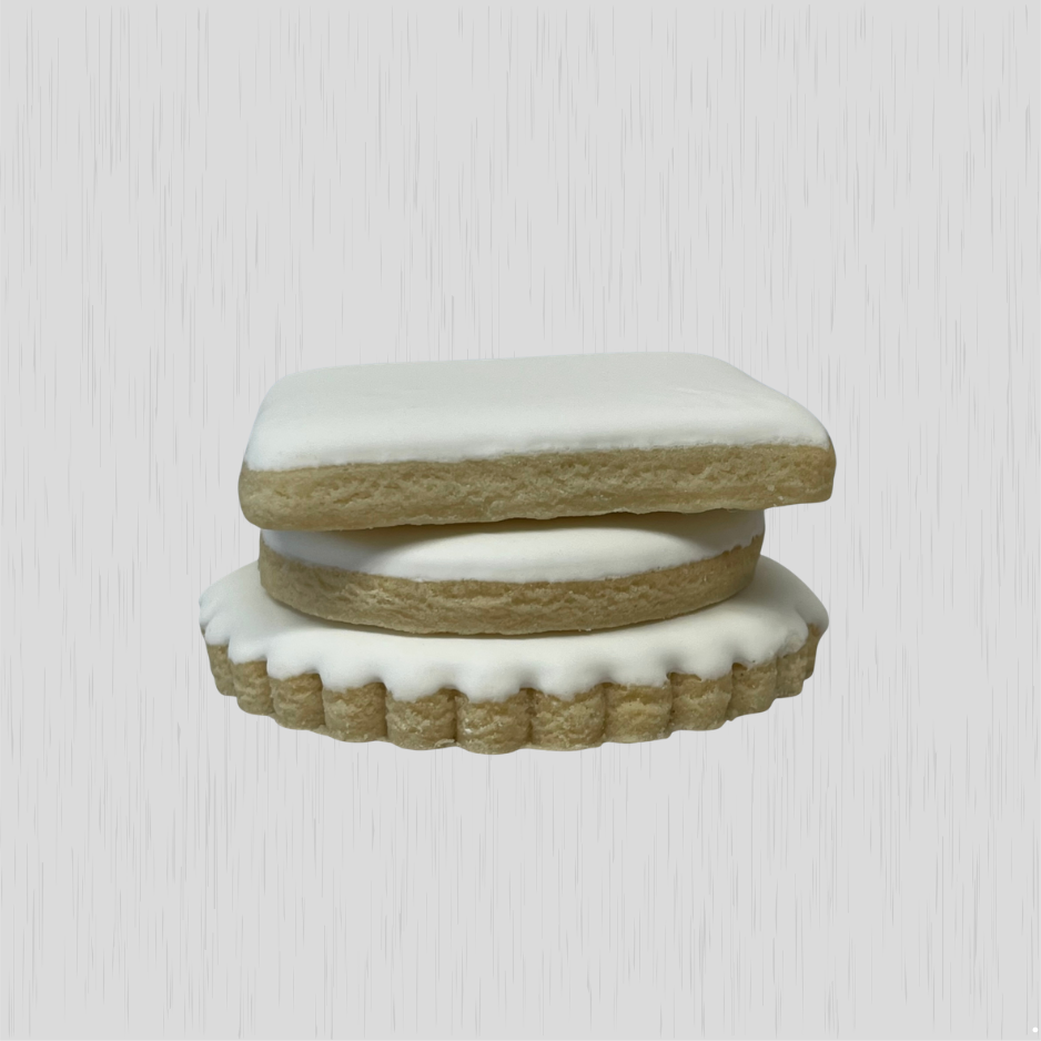 stacked vanilla sugar cookies showing smooth royal icing finish and thickness