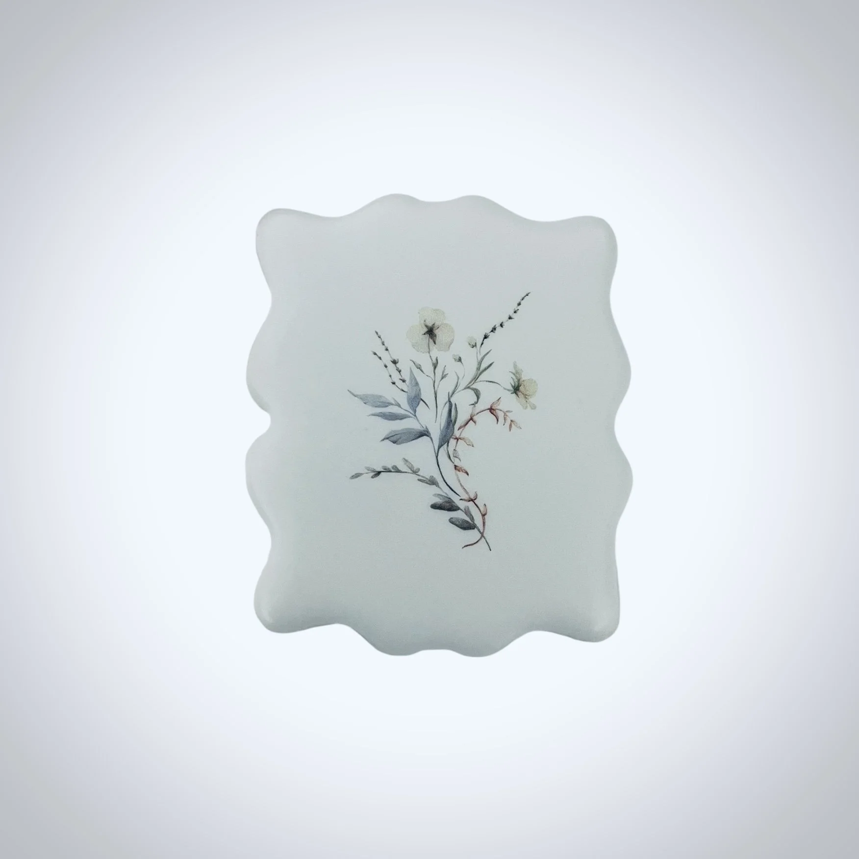 Plaque shaped cookie printed with a minimal floral design using edible ink on white icing. Designed for wedding favors, event table styling and elevated gatherings. Photographed on a white background.