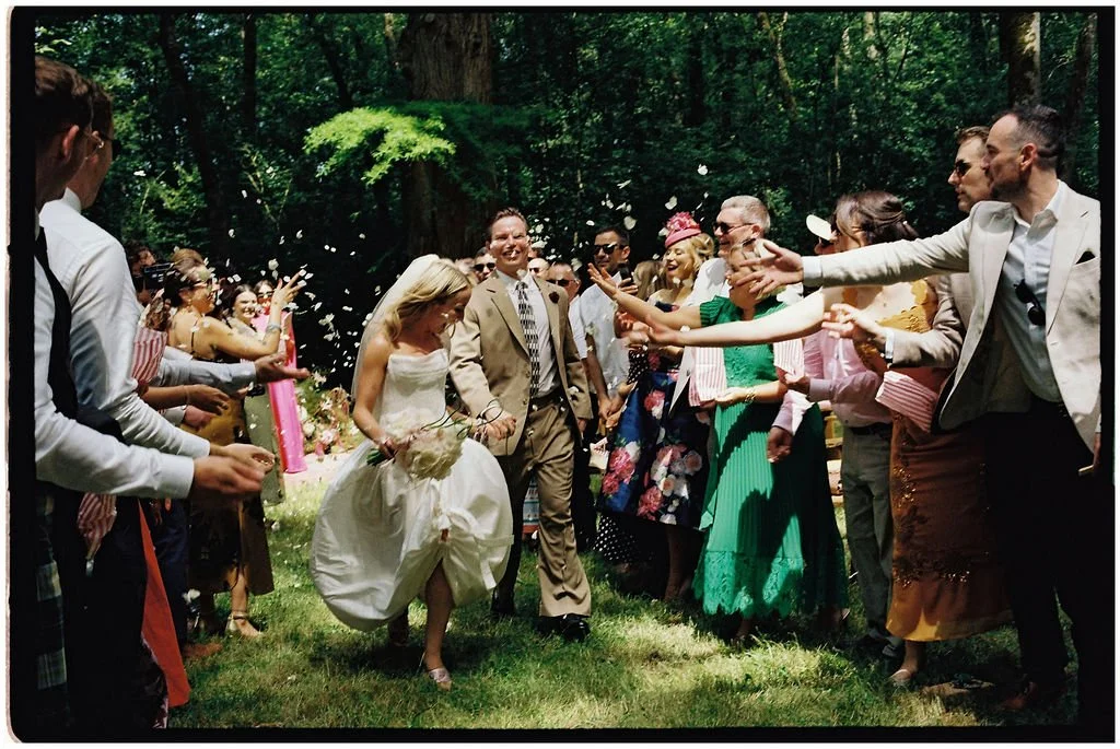 Outdoor wedding ceremony beneath a mature tree at Château Laborde Saint-Martin with sculptural florals and an intimate Irish celebration in the Loire Valley.