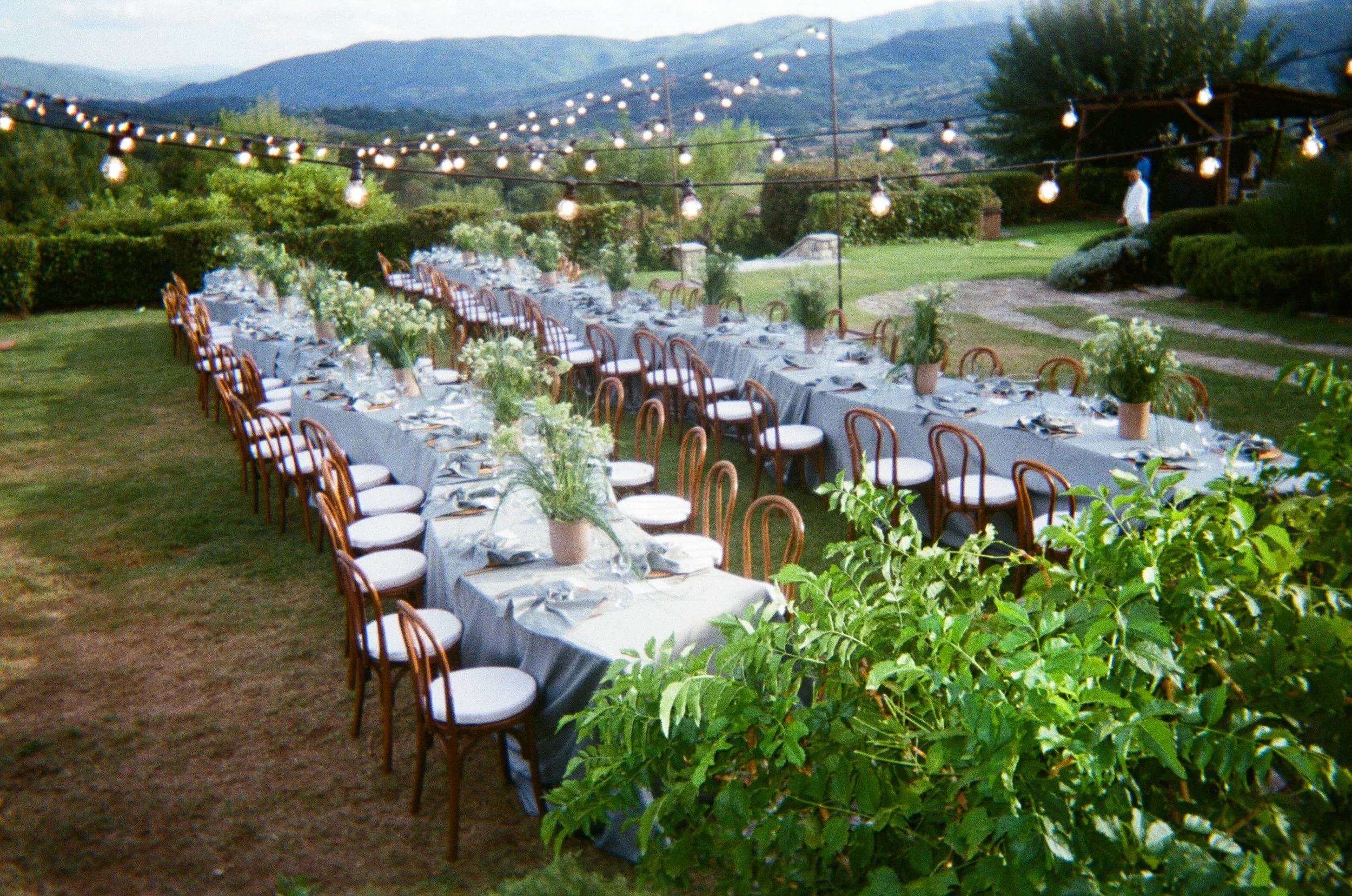 Editorial wedding tablescape in Tuscany combining romantic flowers, considered details and intimate alfresco dining.