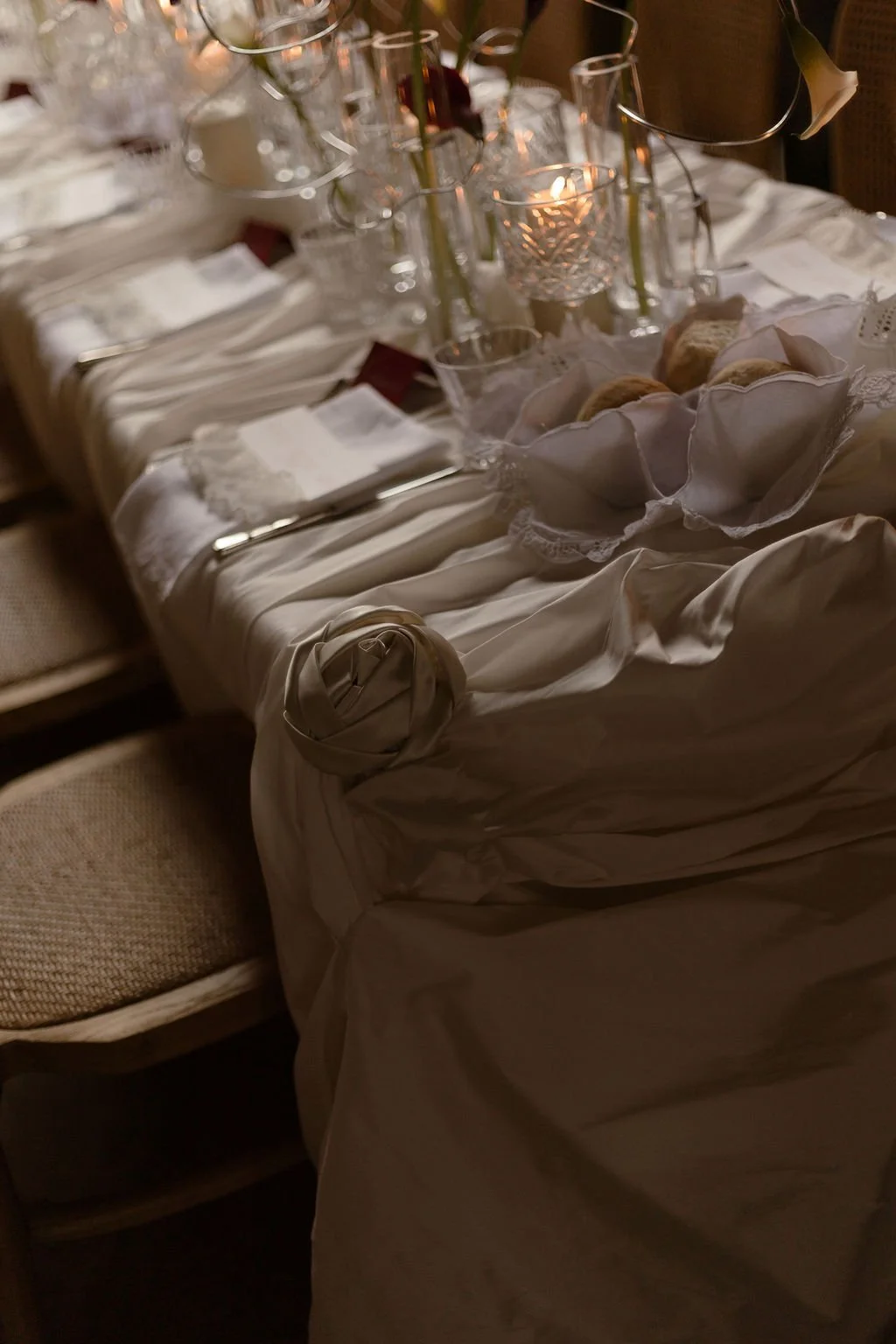 Luxury draped tablescape with flowing satin and romantic vintage satin roses for a refined wedding look