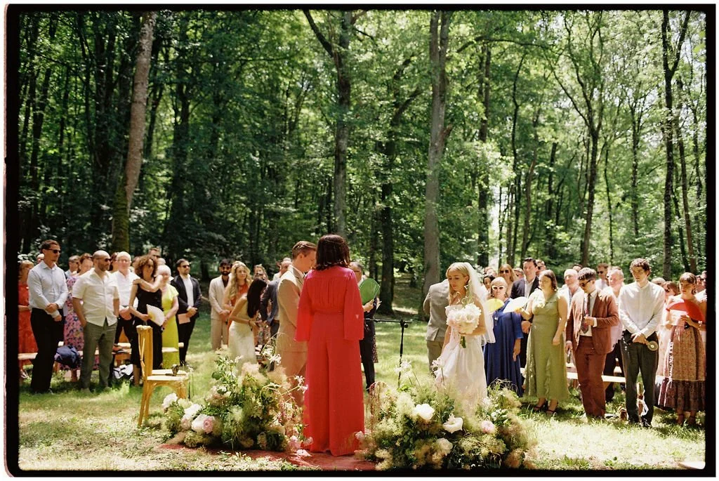 Outdoor wedding ceremony beneath a mature tree at Château Laborde Saint-Martin with sculptural florals and an intimate Irish celebration in the Loire Valley.