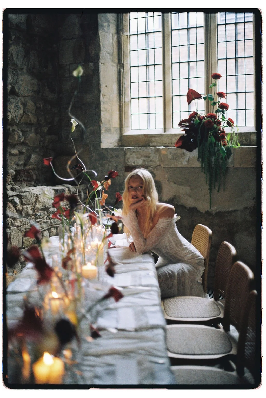 Timeless luxury bridal portrait with vintage-inspired gown, curated table setup, and floral décor.