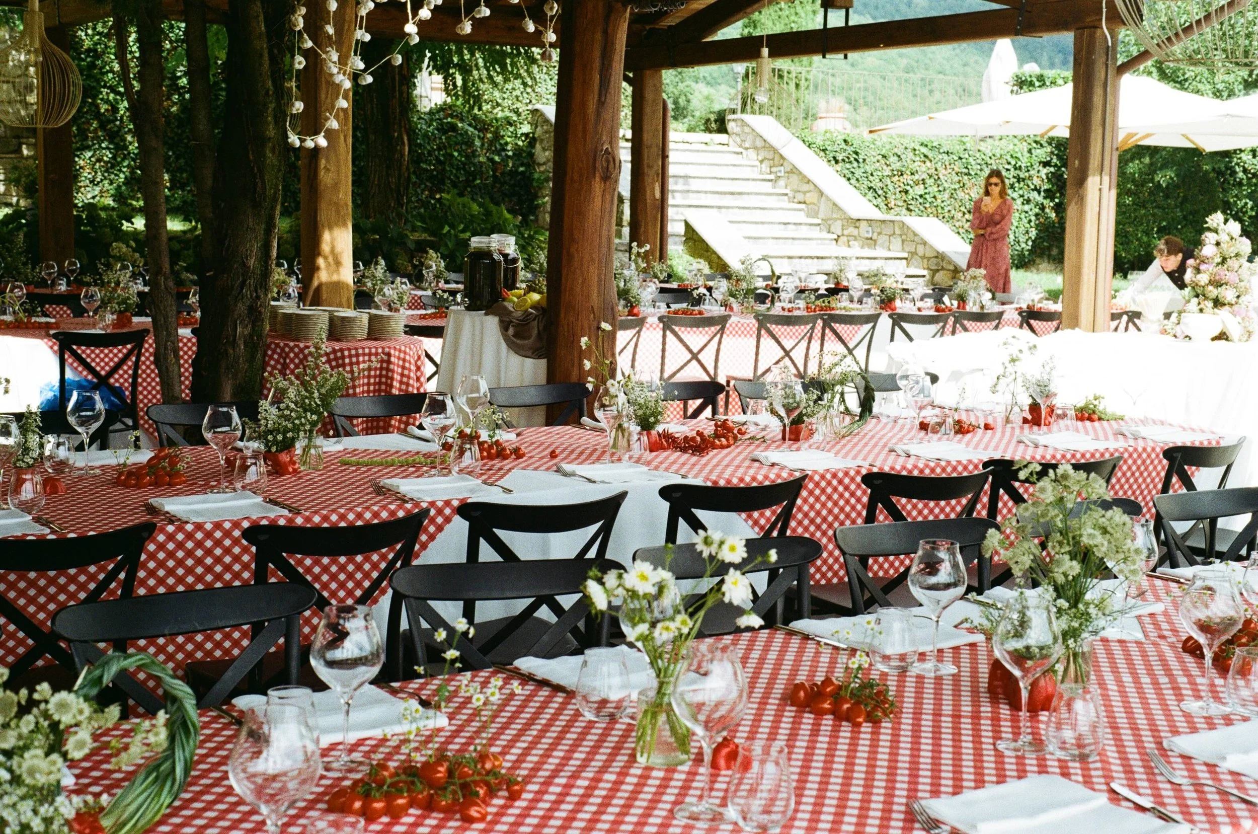 Luxury destination wedding tablescape in Italy featuring bespoke florals, linens and considered details for an outdoor celebration.