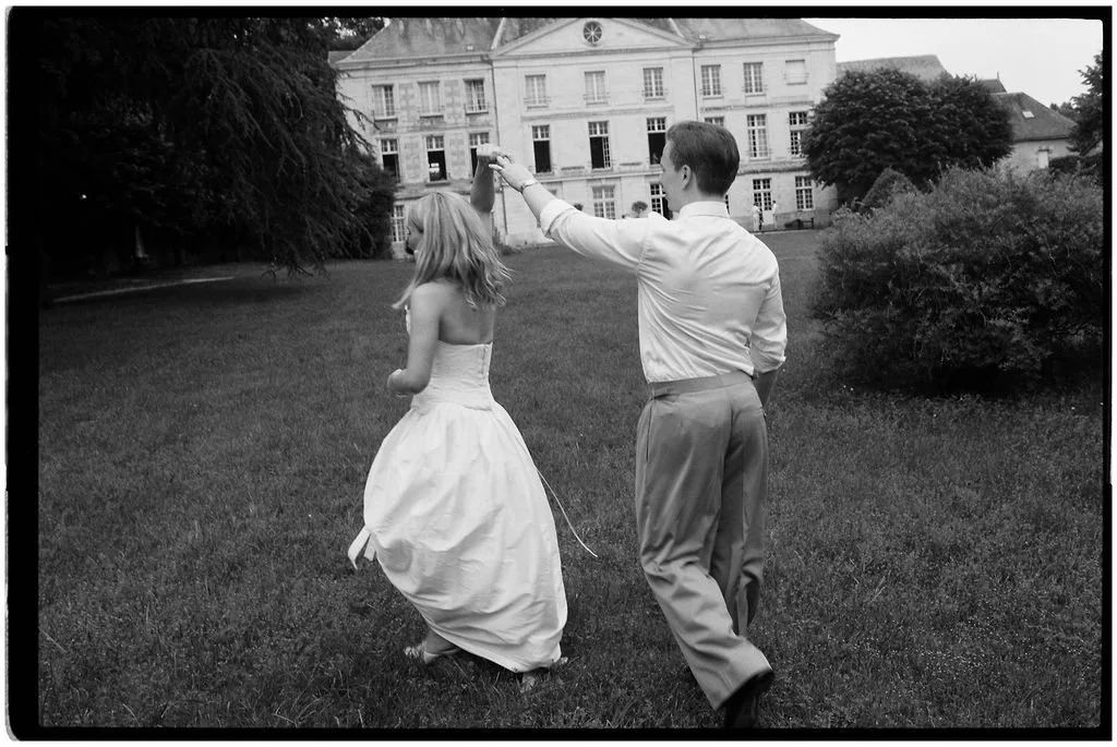 Bride and groom enjoying a romantic portrait in the gardens of Château Laborde Saint-Martin during their luxury Loire Valley destination wedding.