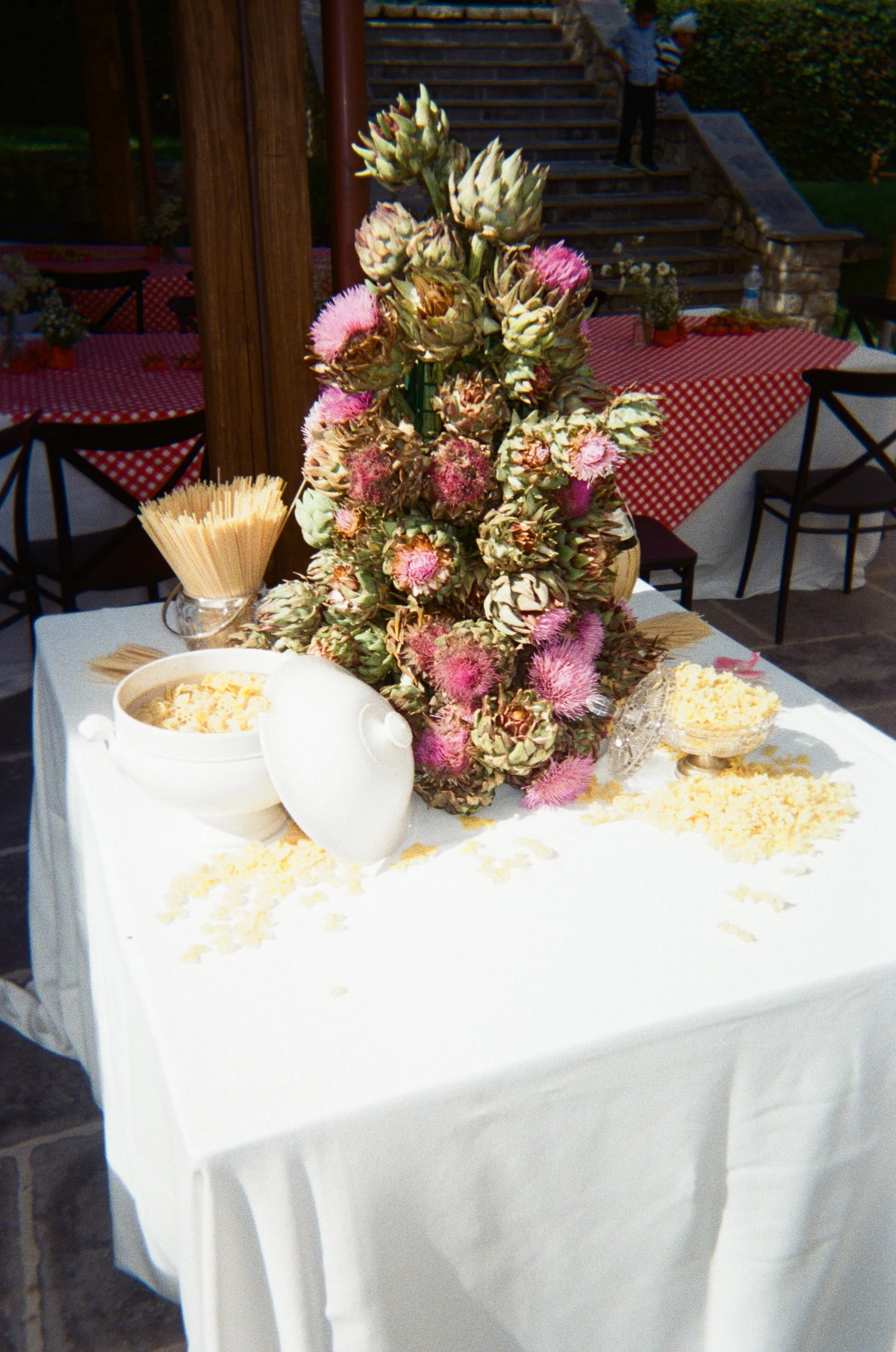 Luxury destination wedding tablescape in Italy featuring bespoke florals, linens and considered details for an outdoor celebration.