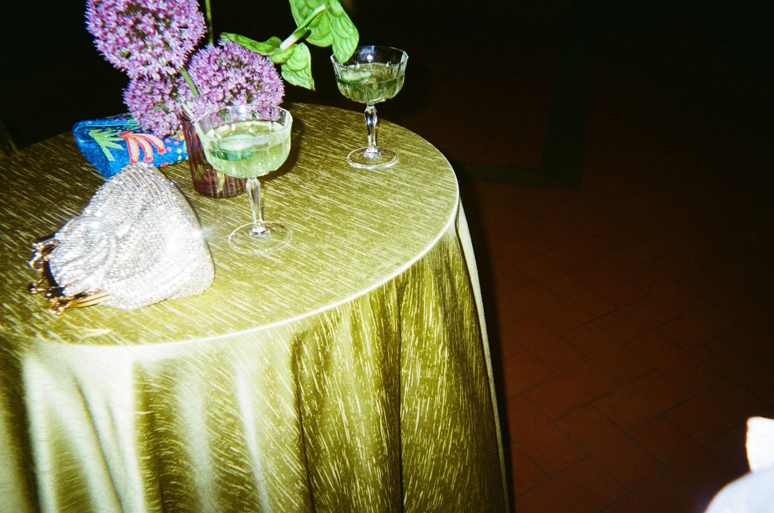 Maximalist destination wedding styling in Italy featuring bold colour, bespoke draping, flowers and an atmospheric outdoor celebration.