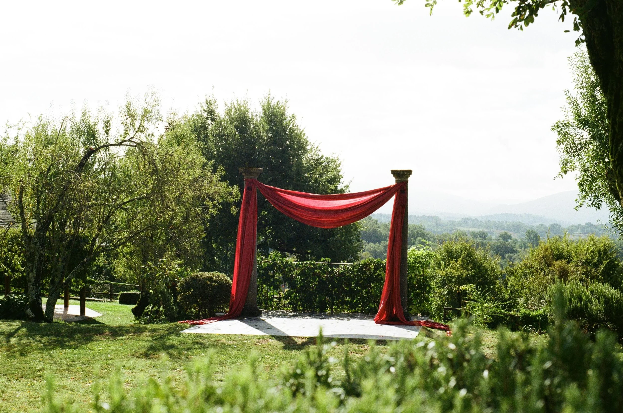 Editorial destination wedding styling in Italy with vibrant florals, personalised details and relaxed outdoor event design.
