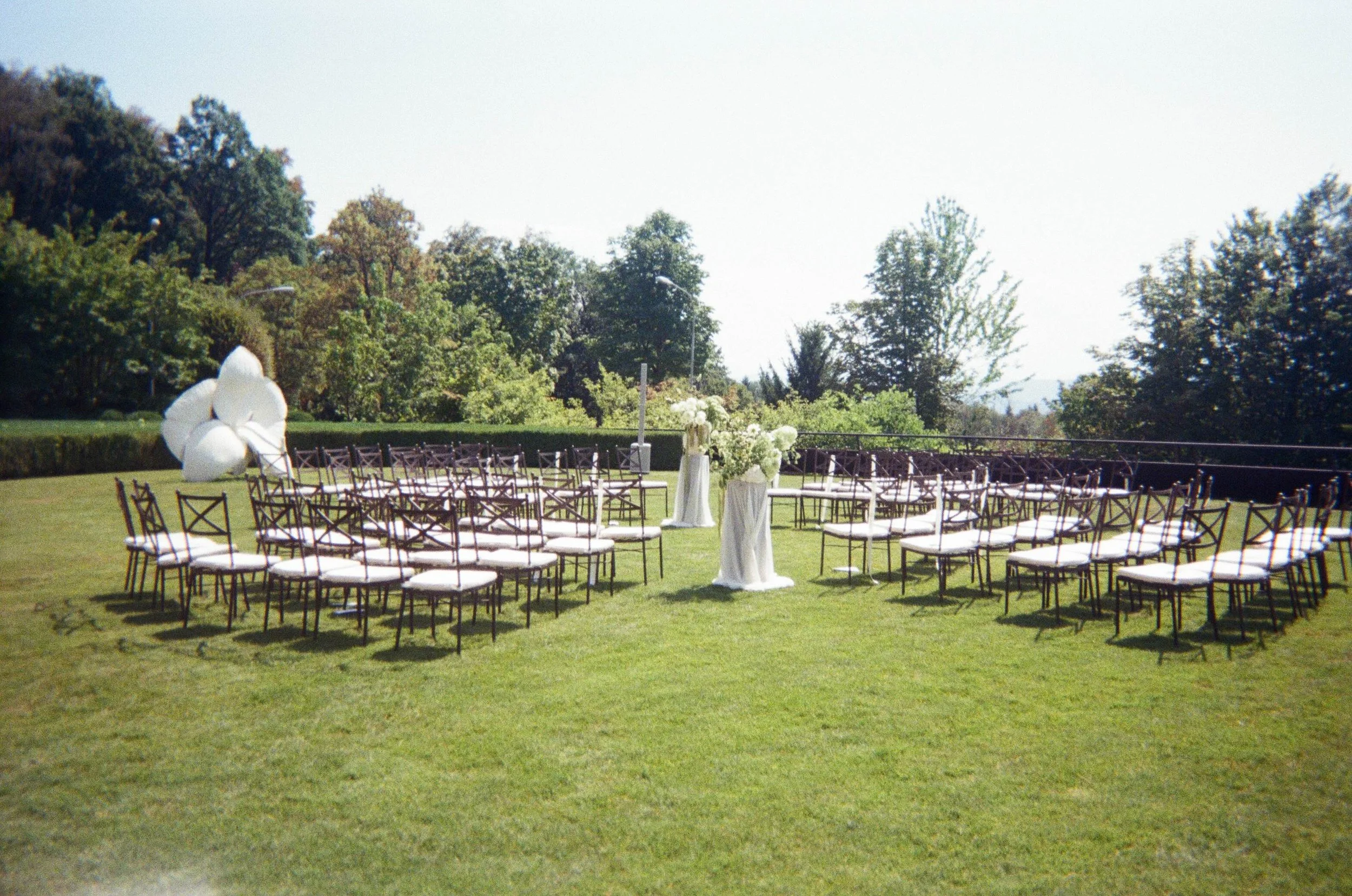 Editorial wedding ceremony at The Dolder Grand, Zurich, with circular outdoor seating and modern floral styling.