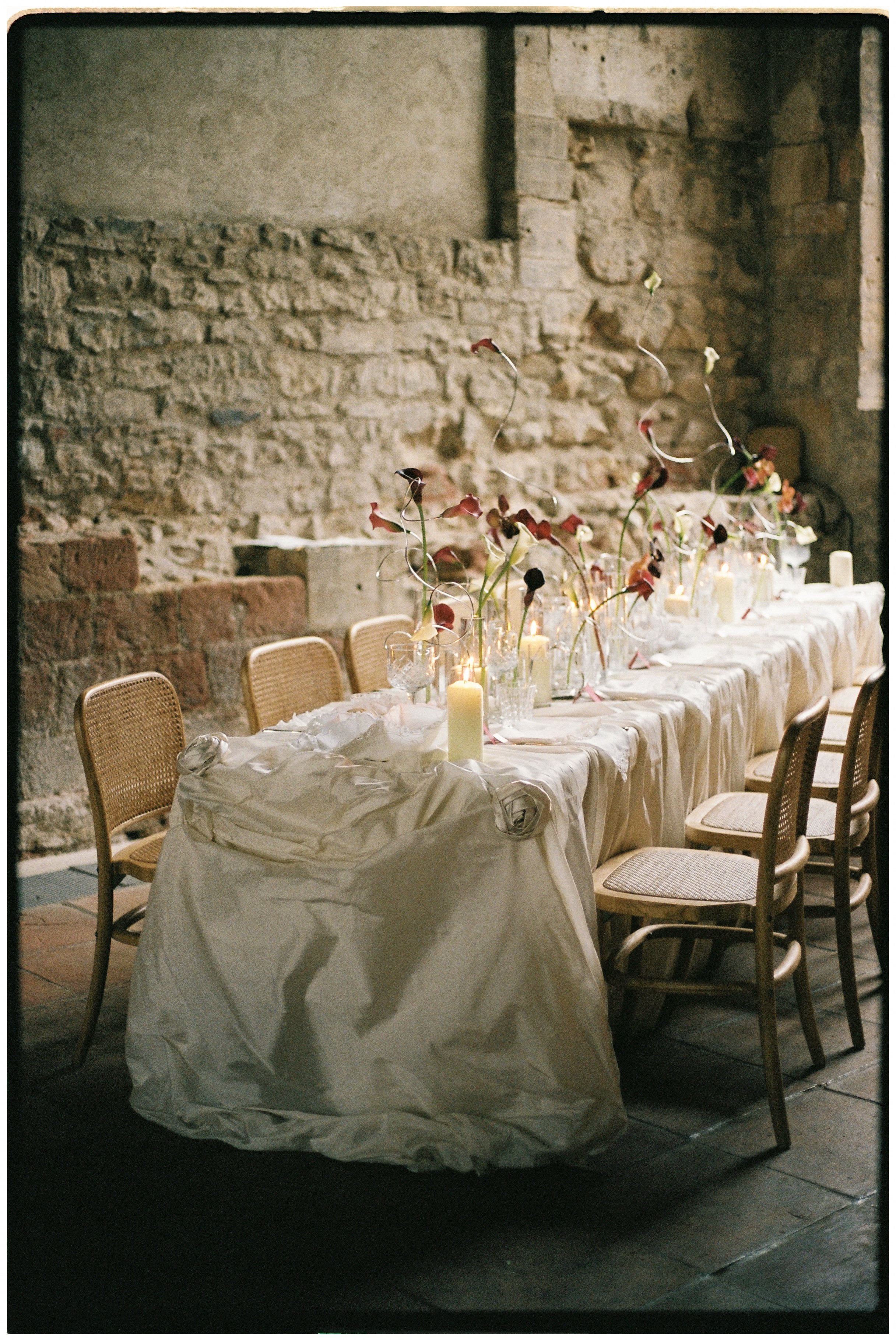 Romantic vintage wedding table styling with blush flowers, candlelight and antique silver details