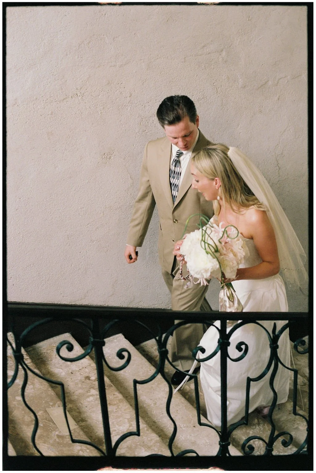 Bride and groom enjoying a romantic portrait in the gardens of Château Laborde Saint-Martin during their luxury Loire Valley destination wedding.
