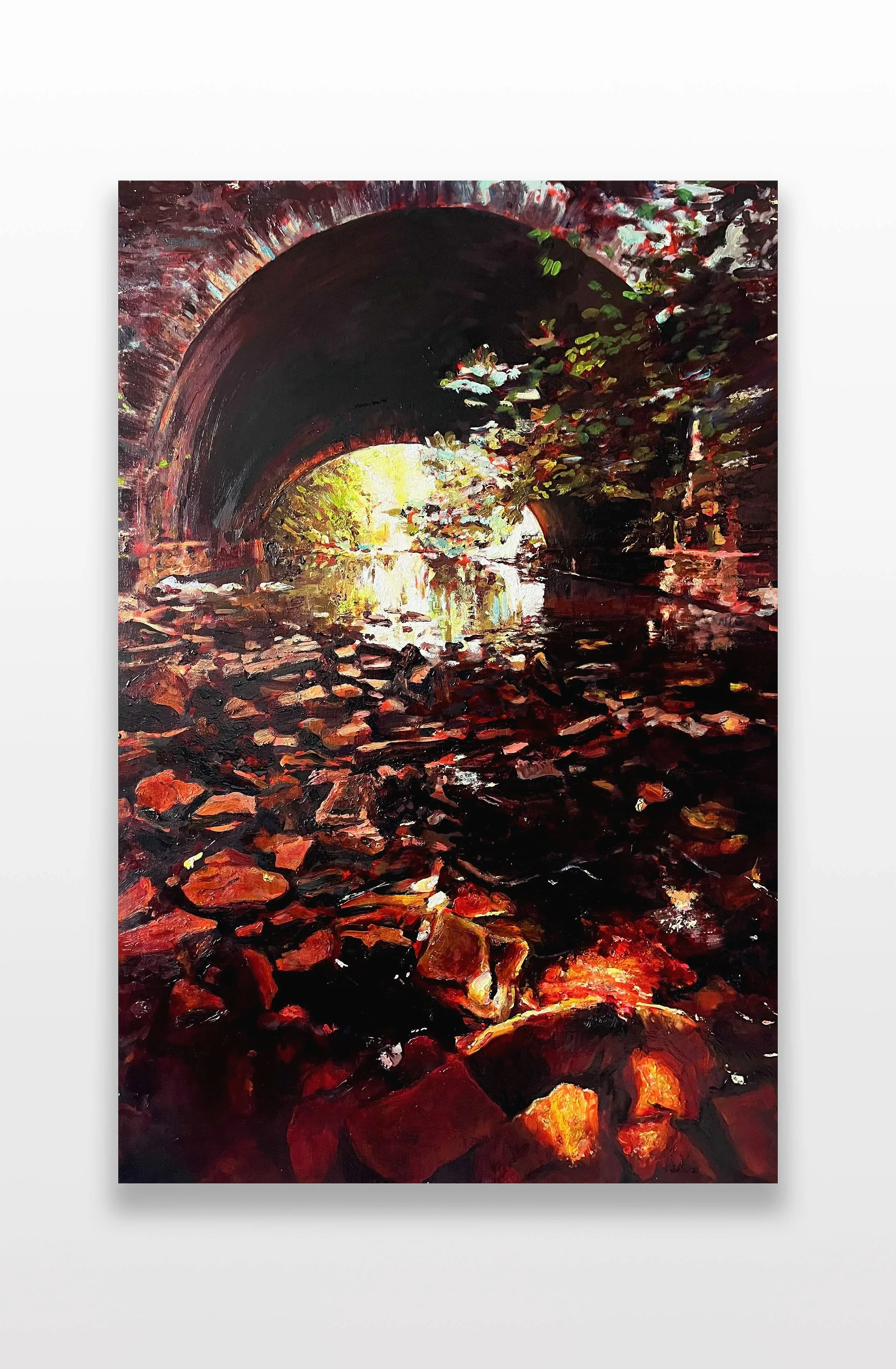 The bridge - An original oil painting by Rob Elgar showing the old bridge on cleeve wood road in Frenchay, Bristol, from the rock strewn semi dry river bed - Golden orange hues concentrate the focus on the deep contrast between light and shade.