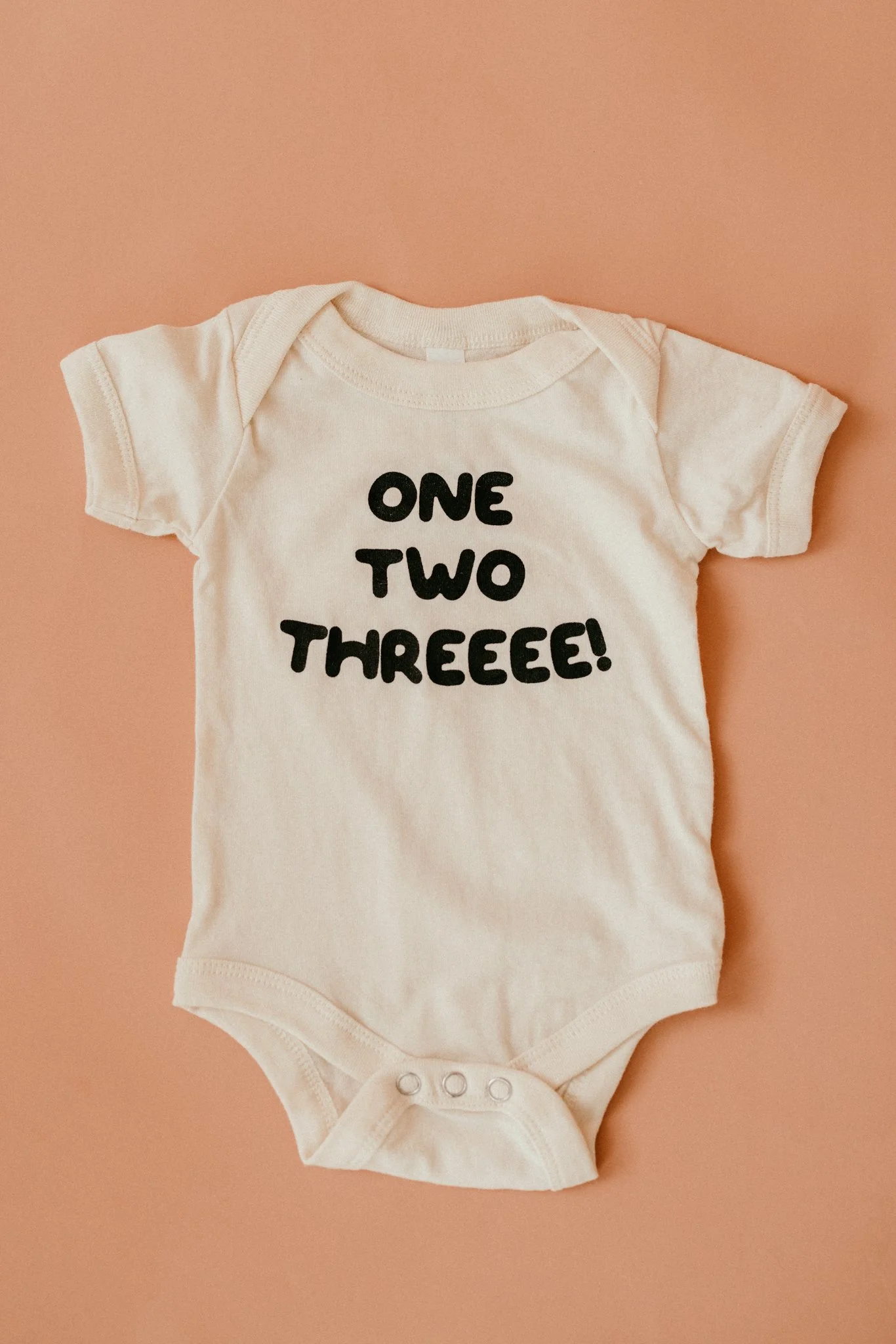 ONE TWO THREEEE! BABY ONESIE