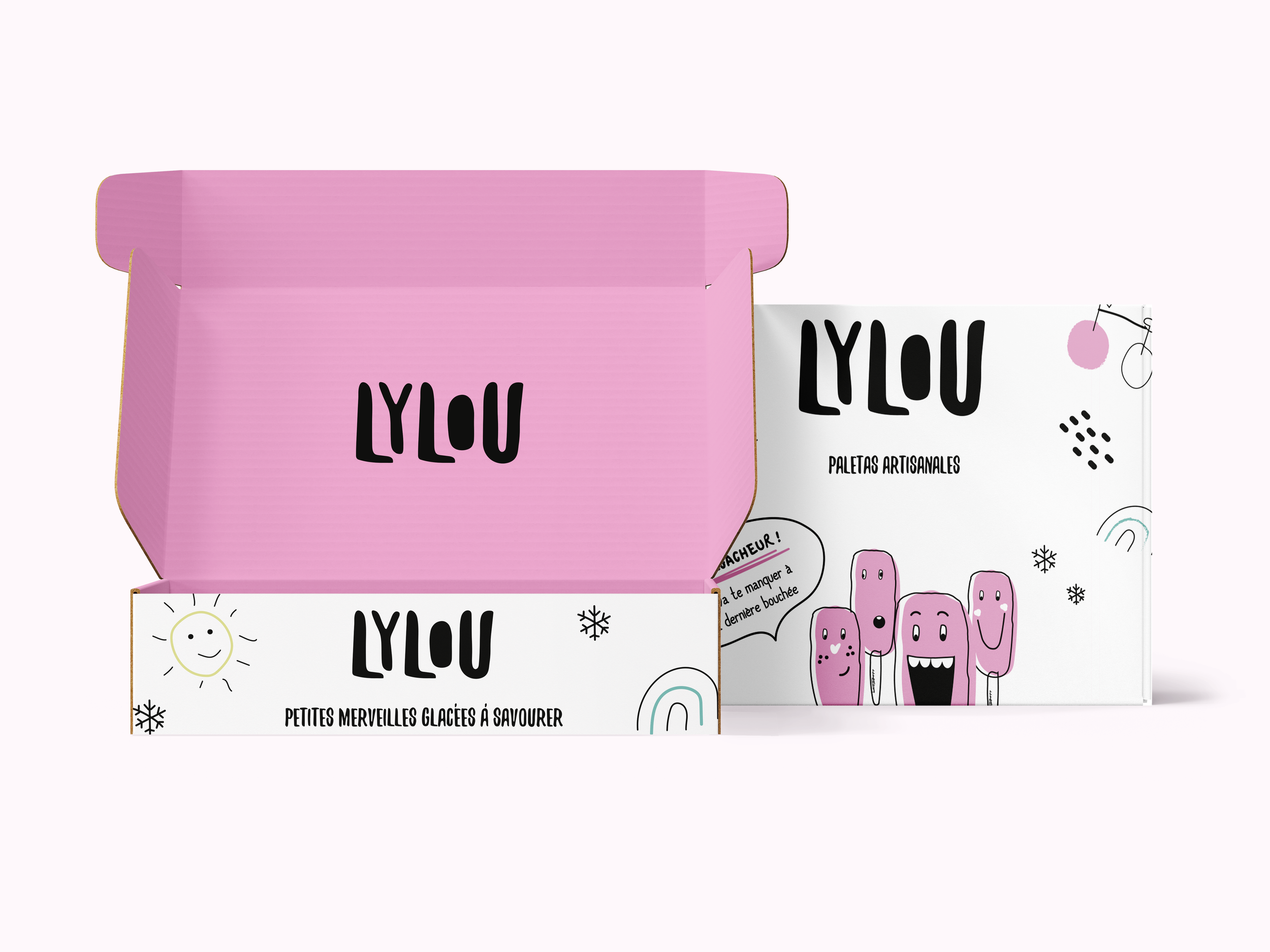 Deux boîtes colorées, une rose et une blanche, avec des illustrations et du texte en français, contenant probablement des produits artisanaux ou artisanaux, comme des pâtisseries ou des gourmandises.
