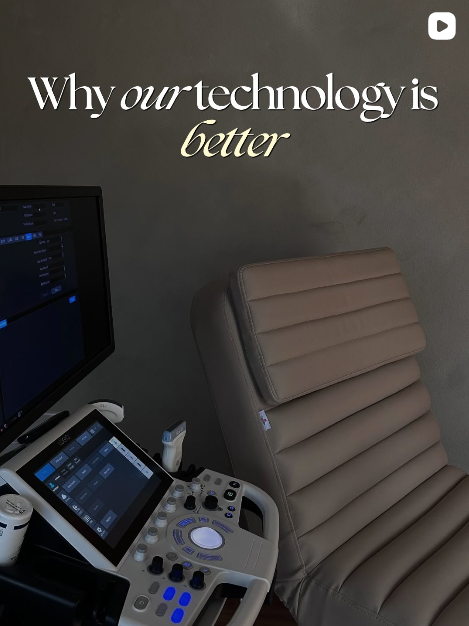 An ultrasound machine next to a beige office chair, with a wall displaying the text 'Why our technology is better' in black and gold lettering.