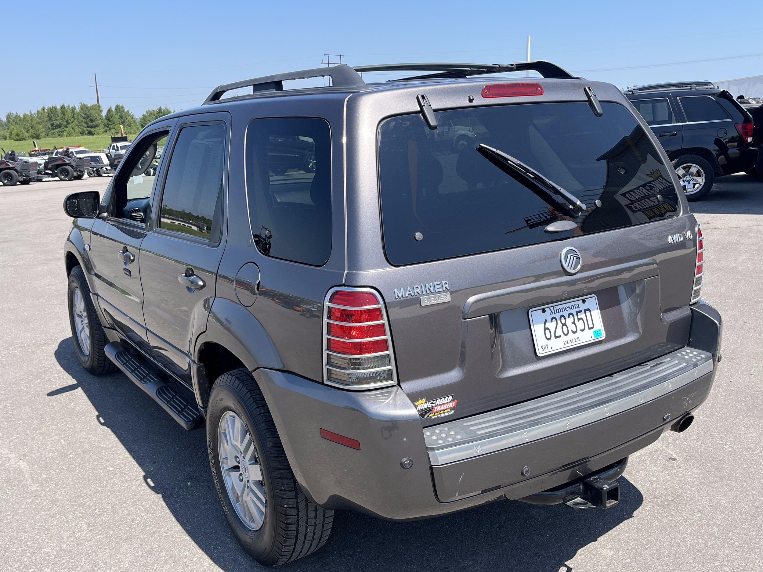 Gray Mercury Mariner SUV parked in a lot on a clear day.
