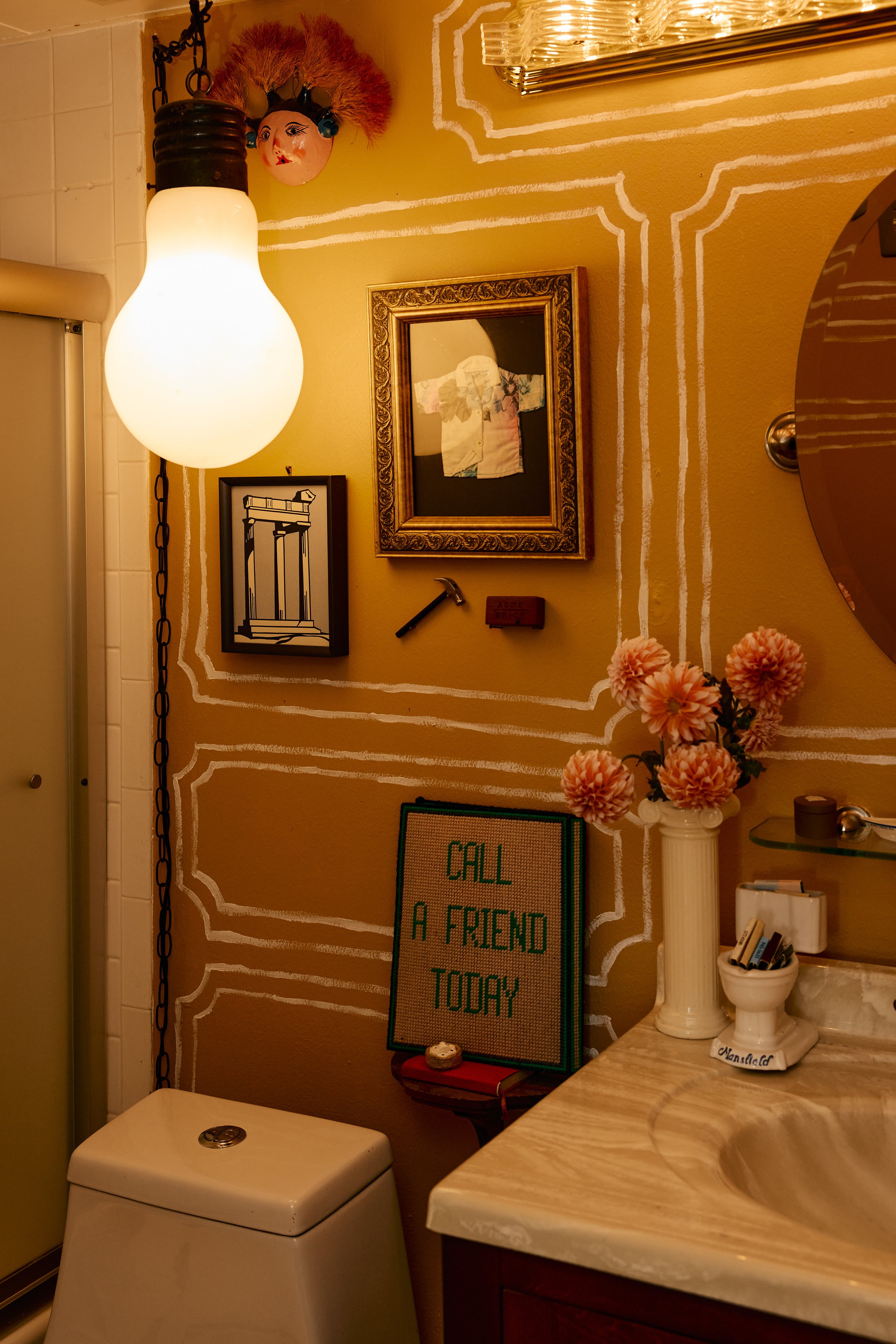 Cozy, eclectic bathroom in Zach and Taylor's Houston, TX apartment. Image by Austin-based lifestyle photographer, Mackenzie Smith.