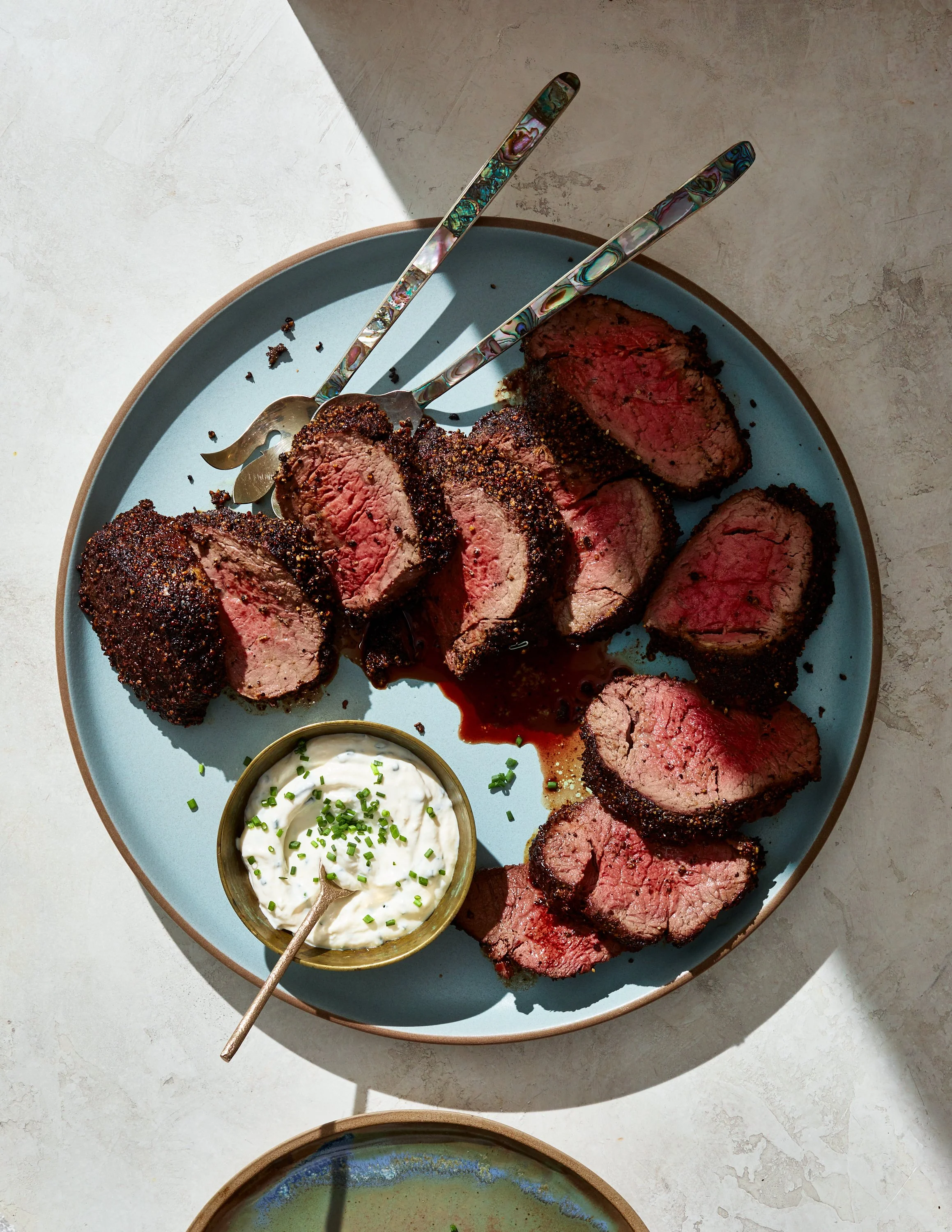 Peppercorn-crusted Beef Tenderloin with horseradish cream for Jen Hatmaker's cookbook, Feed These People. Image by Austin-based food photographer, Mackenzie Smith.