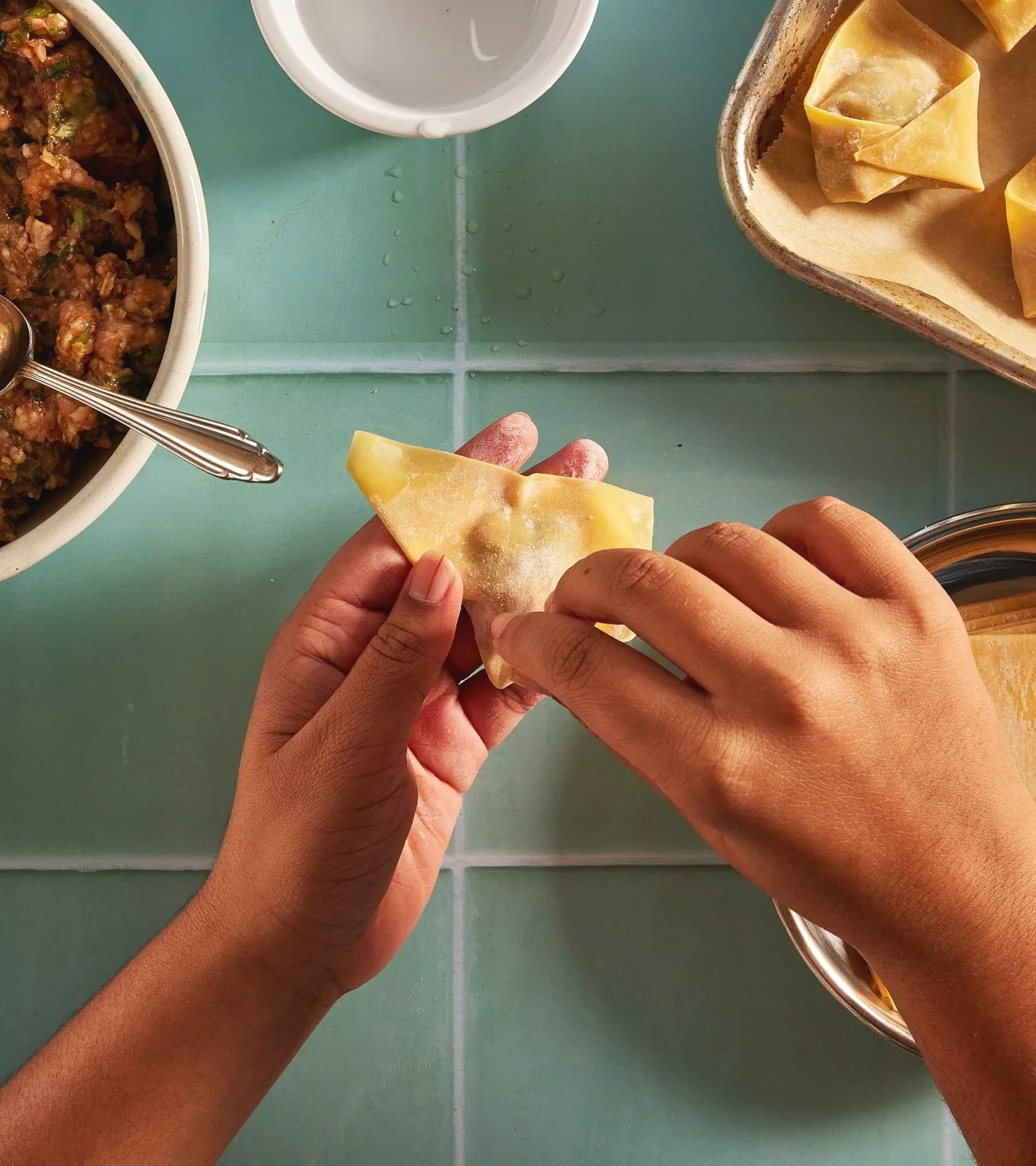 Making pork and chive dumplings for Priya's Kitchen Adventures cookbook. Image by Austin-based food photographer, Mackenzie Smith.