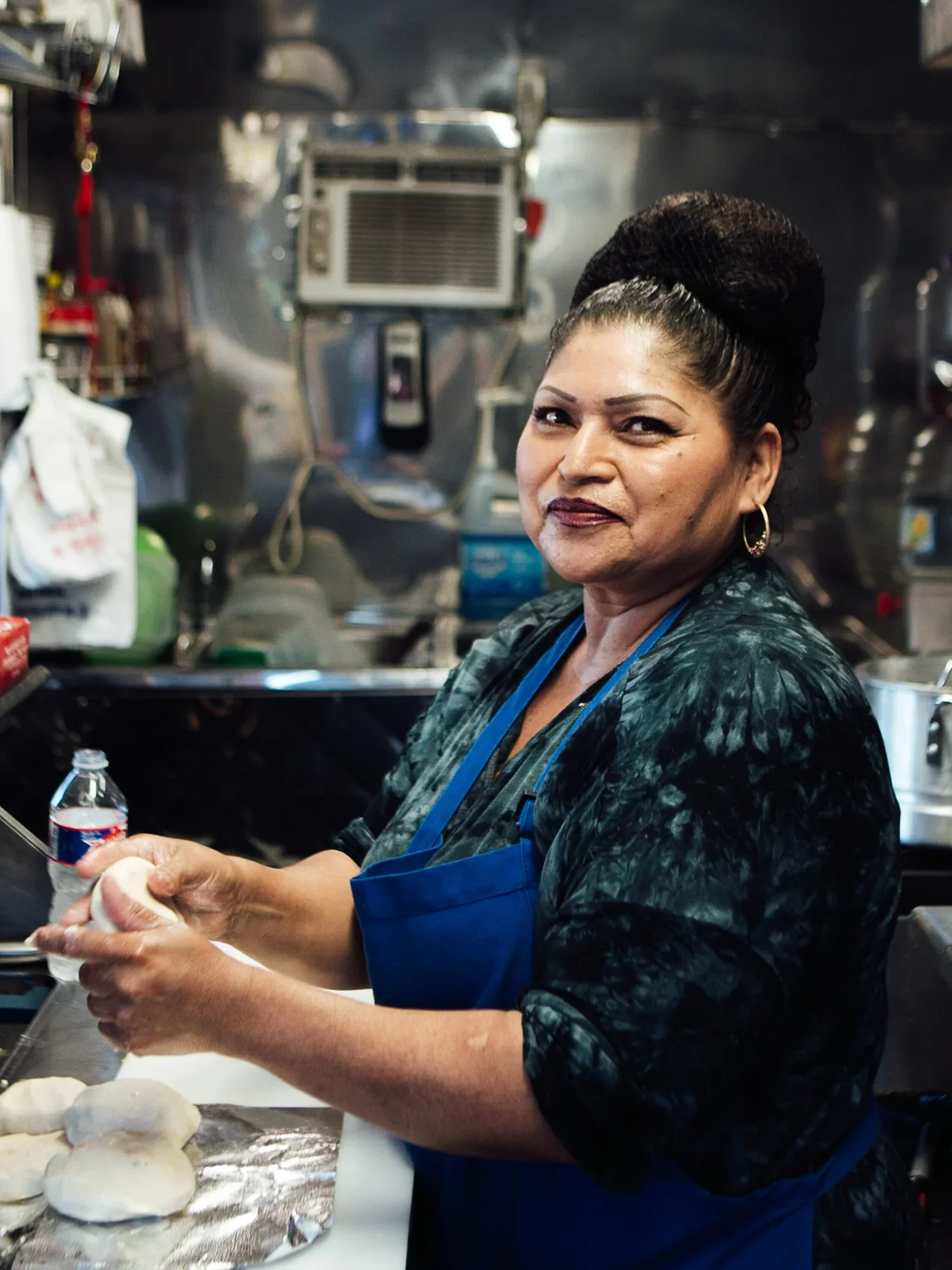 Portrait of Chef Doris Mendoza at Pupuseria. Image by Austin-based food and restaurant photographer, Mackenzie Smith.