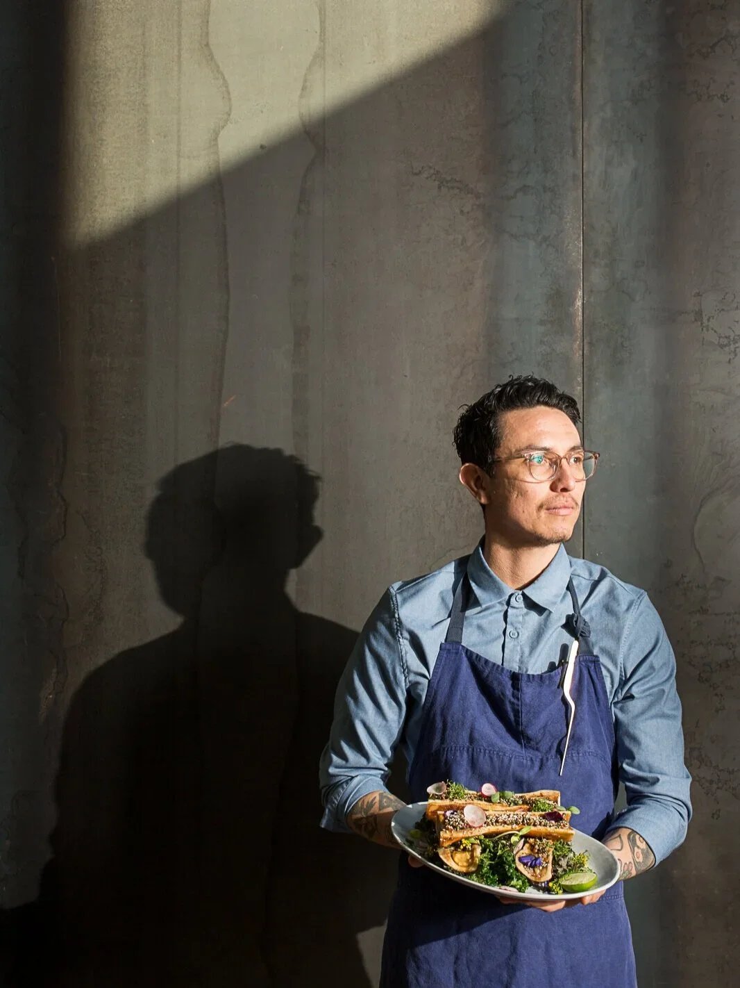 Portrait of chef Alan Delgado at Comedor with Beef Tallow Tacos. Image taken take for Texas Monthly, by Austin-based portrait photographer, Mackenzie Smith.
