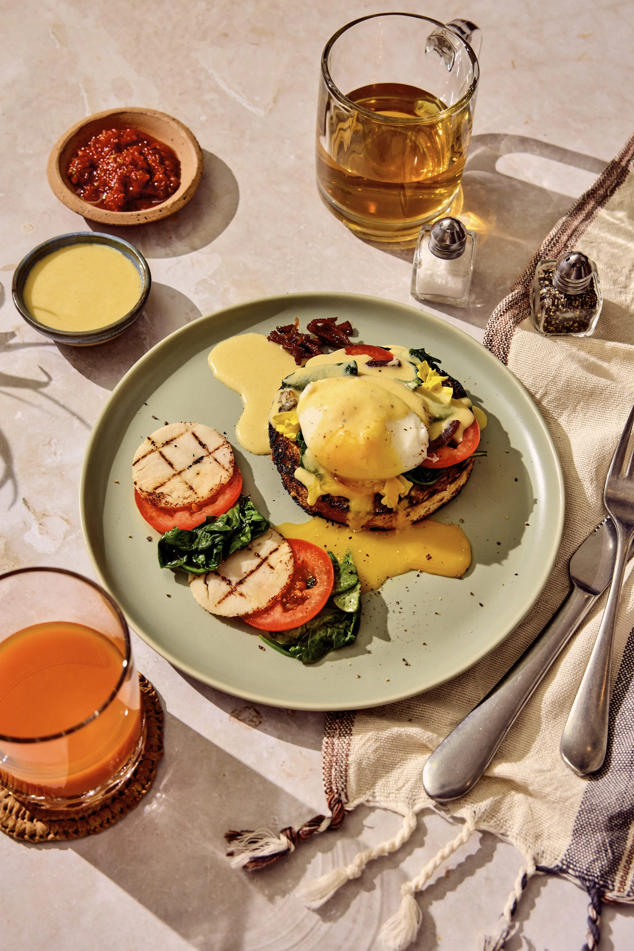 Turkey eggs benedict by Chef Pete Ghione for Canyon Ranch Wellness Resorts. Props styled by Audrey K. Davis. Image by Austin-based food and lifestyle photographer, Mackenzie Smith.