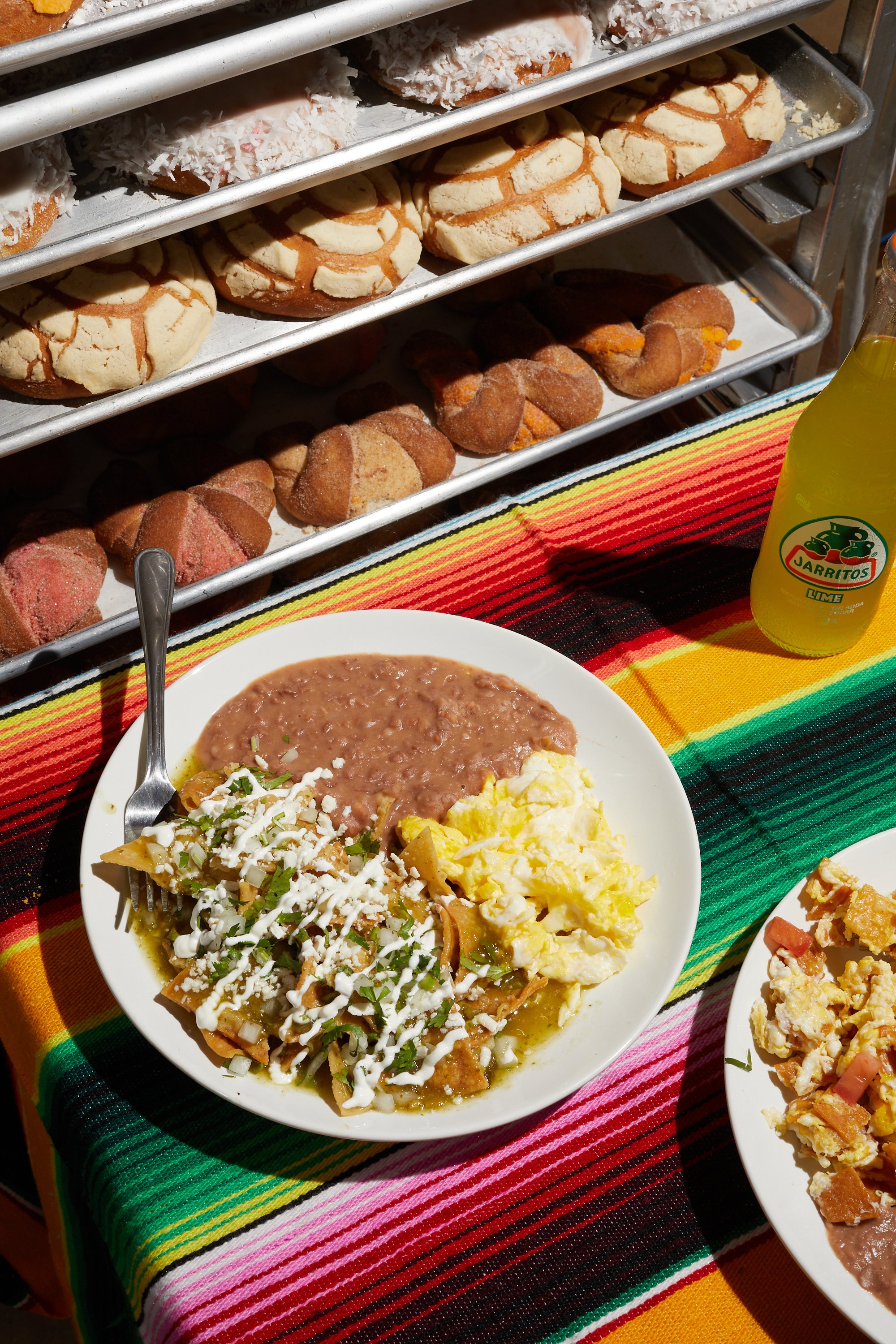 Chilaquiles breakfast plate and fresh conchas. Image by Austin-based food photographer, Mackenzie Smith.