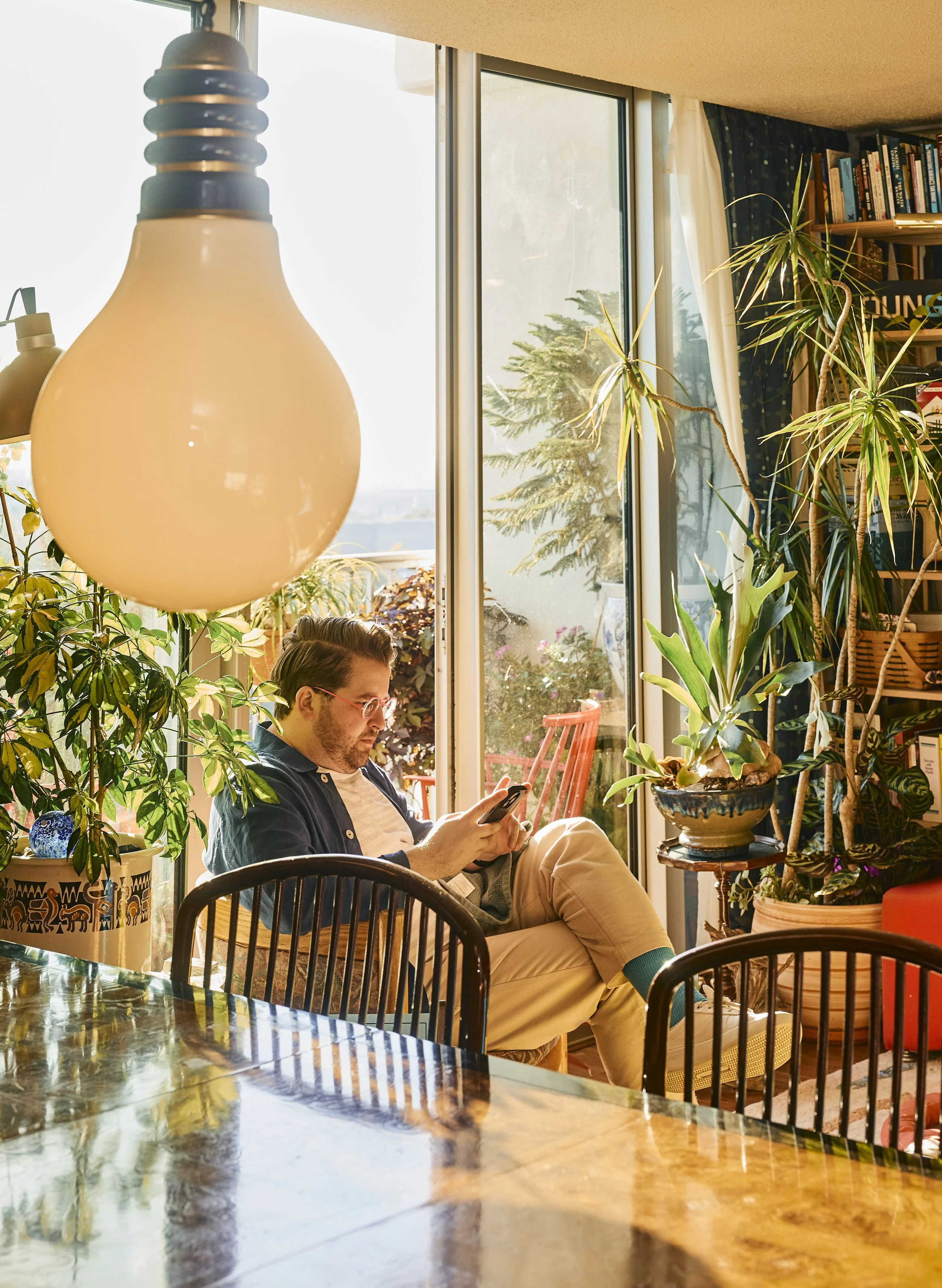 Taylor reading in his Houston, TX apartment. Image by Austin-based portrait and lifestyle photographer, Mackenzie Smith.