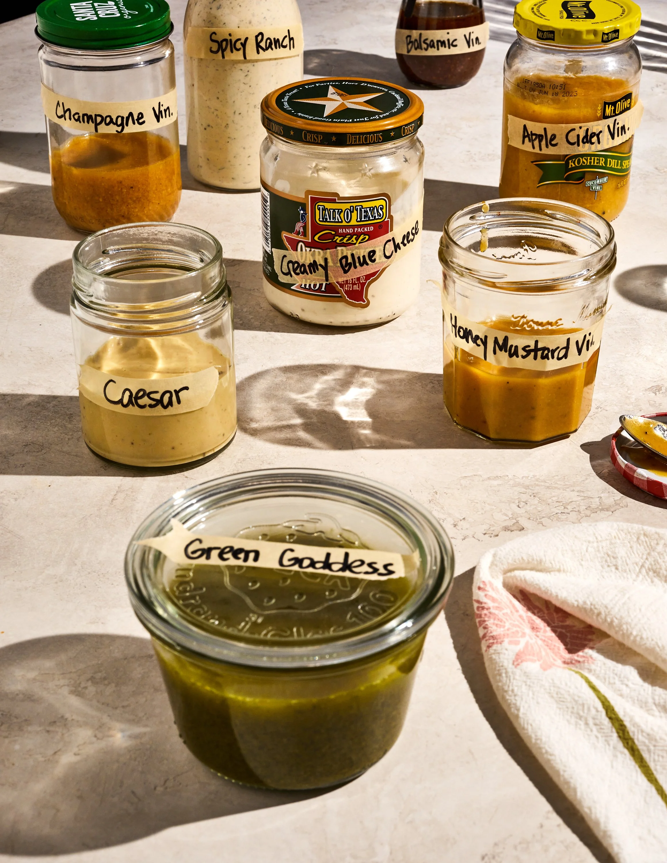 Homemade sauces and dressings for Jen Hatmaker's cookbook, Feed These People. Image by Austin-based food photographer, Mackenzie Smith.