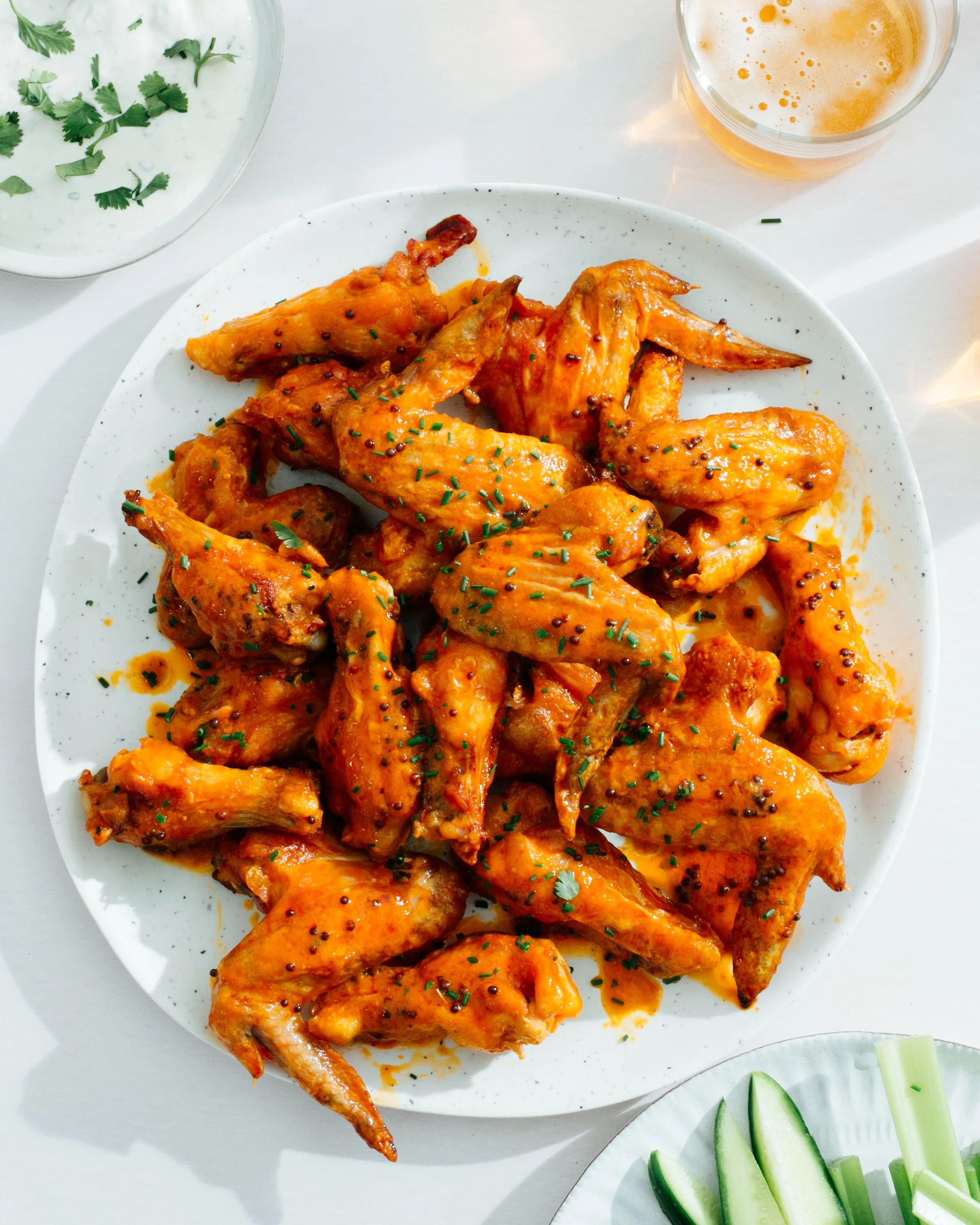 Chicken wings made with Brooklyn Delhi's hot sauce. Image by Austin-based product photographer, Mackenzie Smith.