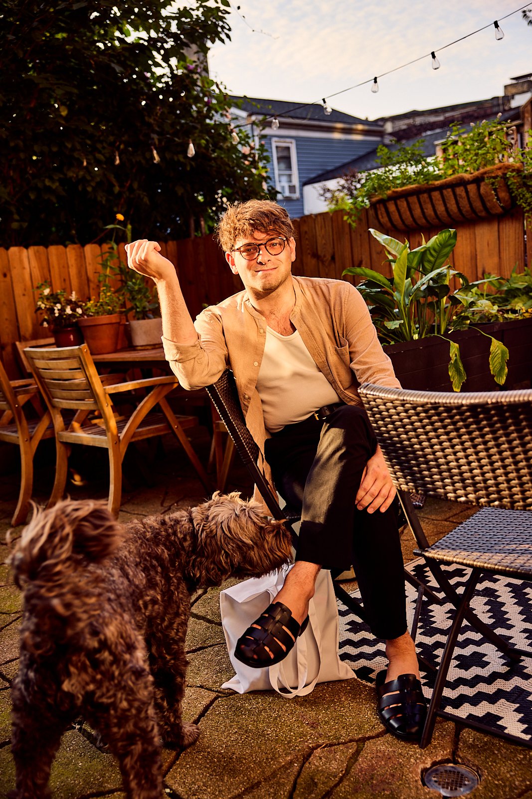 Bobby and his dog on the back patio of their Pittsburgh, PA townhome. Image by Austin-based lifestyle photographer, Mackenzie Smith.