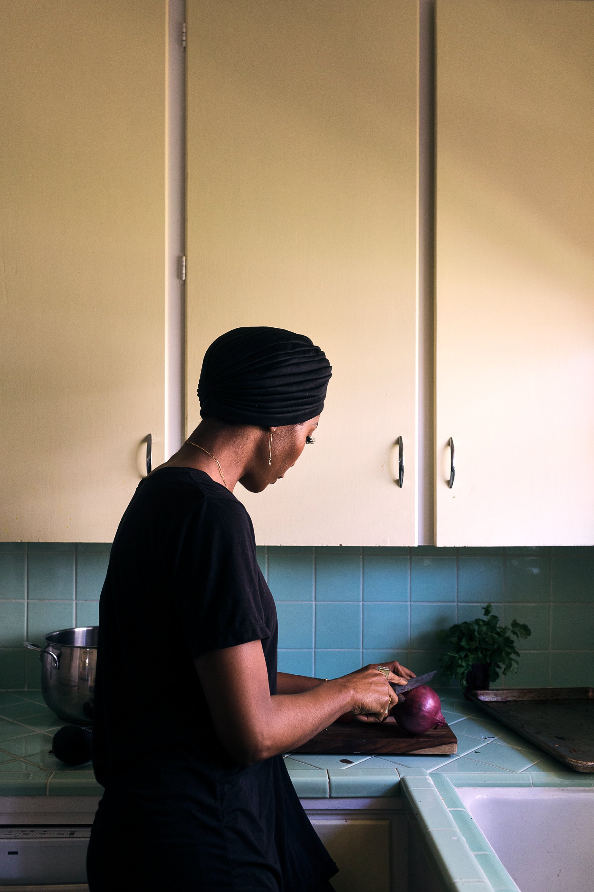 Portrait of Robin Beltran in her kitchen. Image by Austin-based lifestyle photographer, Mackenzie Smith.