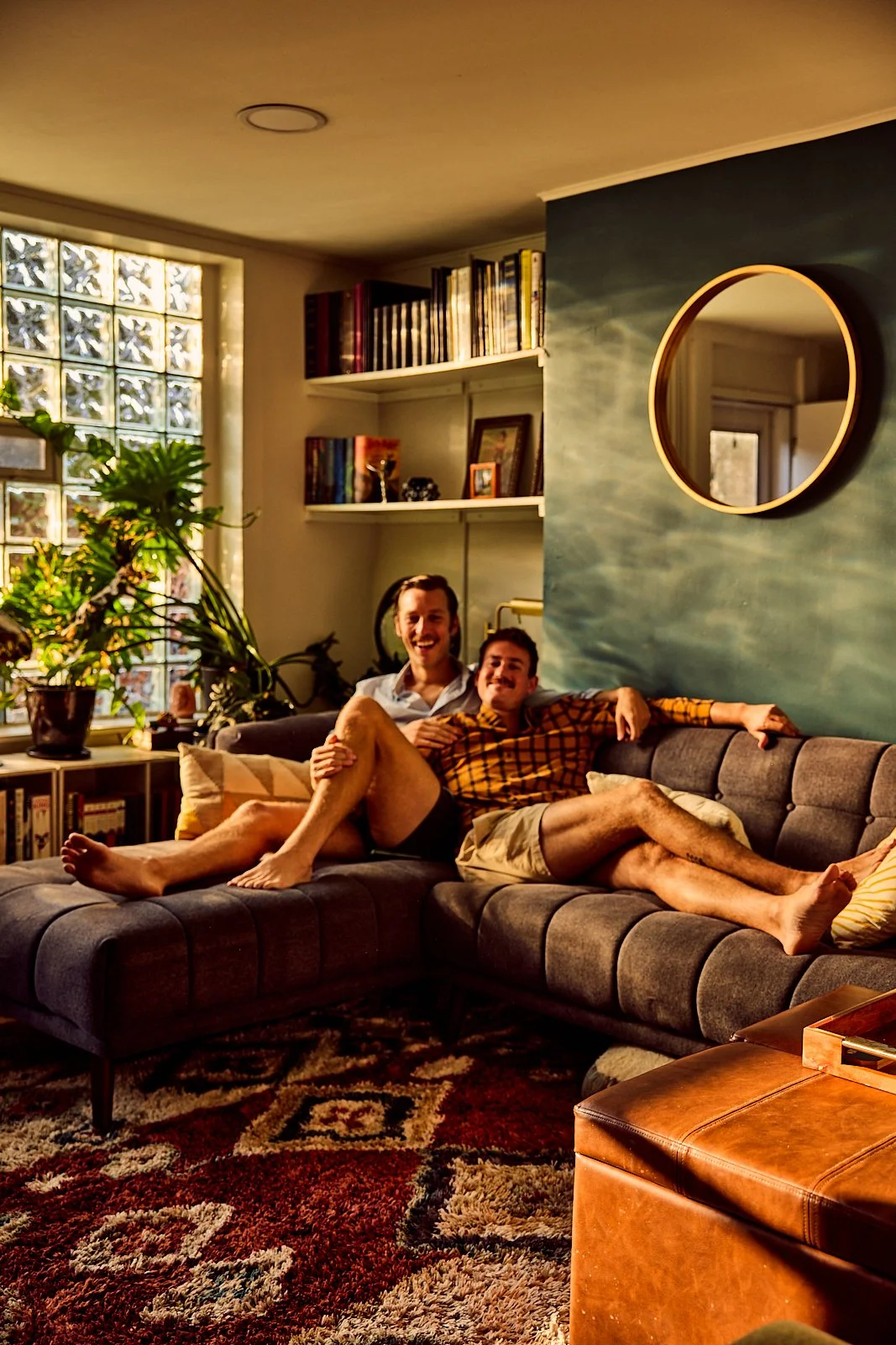 Alexander and Bobby lounging in their Pittsburgh, PA townhome. Image by Austin-based lifestyle photographer, Mackenzie Smith.