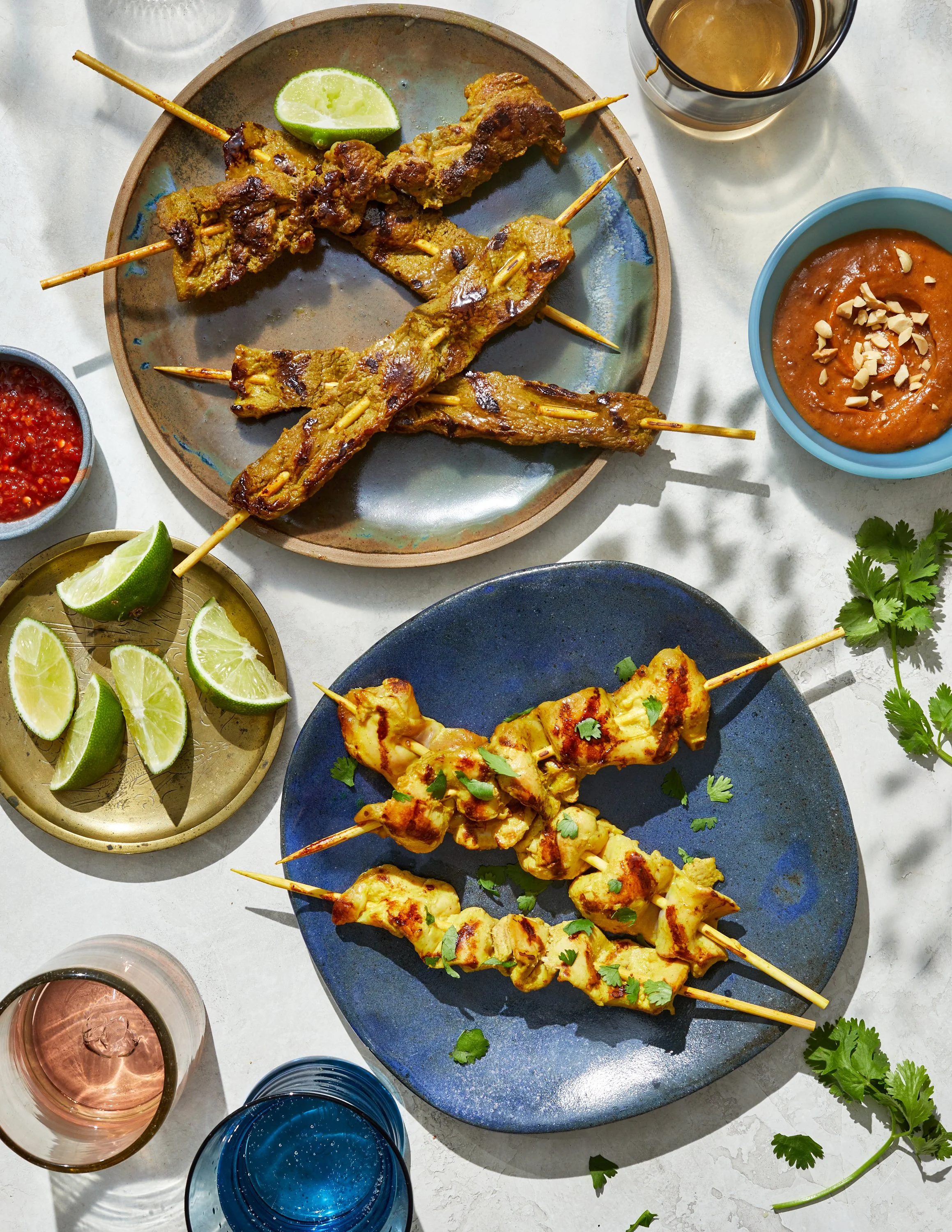 Chicken and beef satay with peanut sauce by Jen Hatmaker for her cookbook, Feed These People. Image by Austin-based food photographer, Mackenzie Smith.