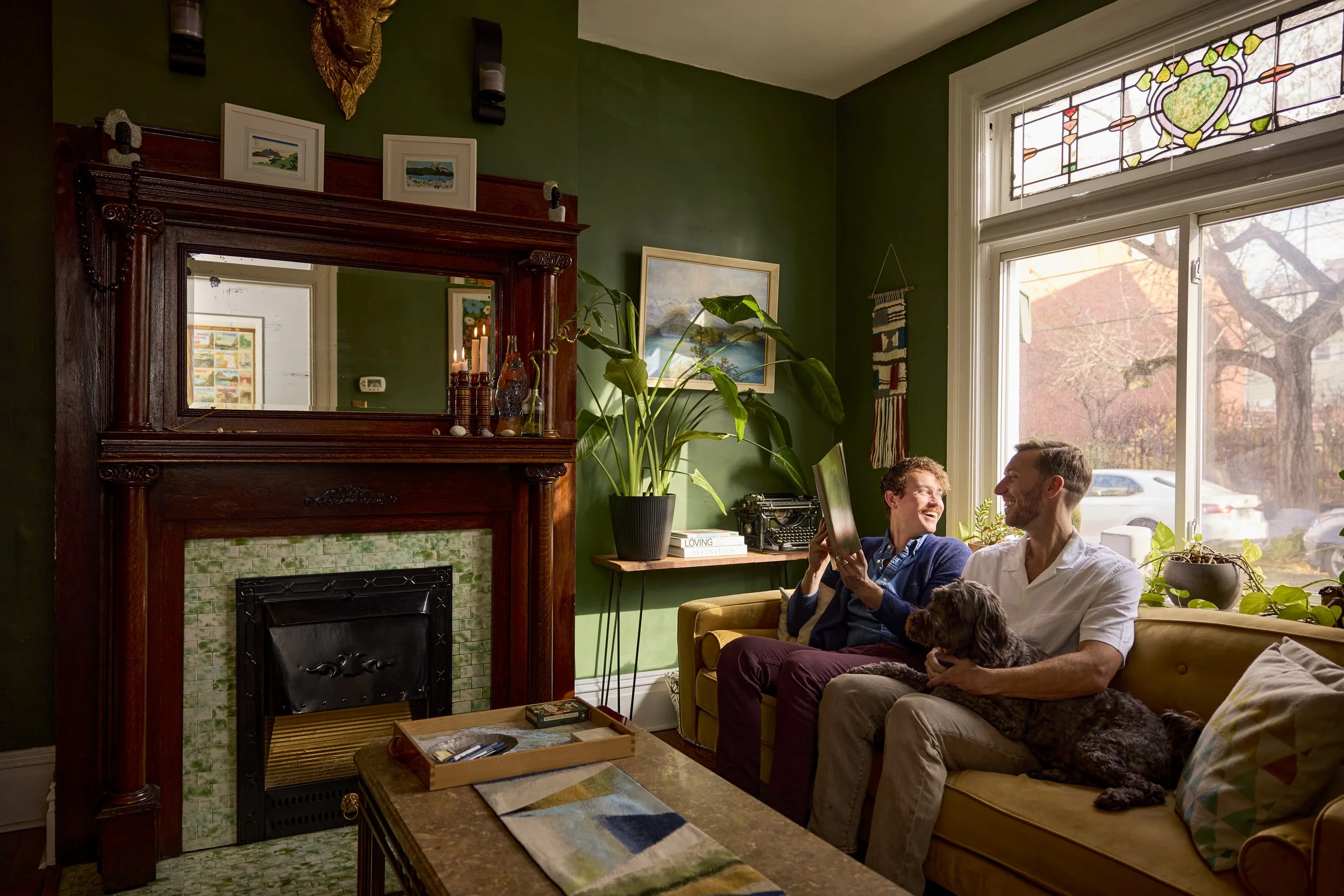 Alexander and Bobby lounging in their front sitting room with the fireplace. Image by Austin-based lifestyle photographer, Mackenzie Smith.