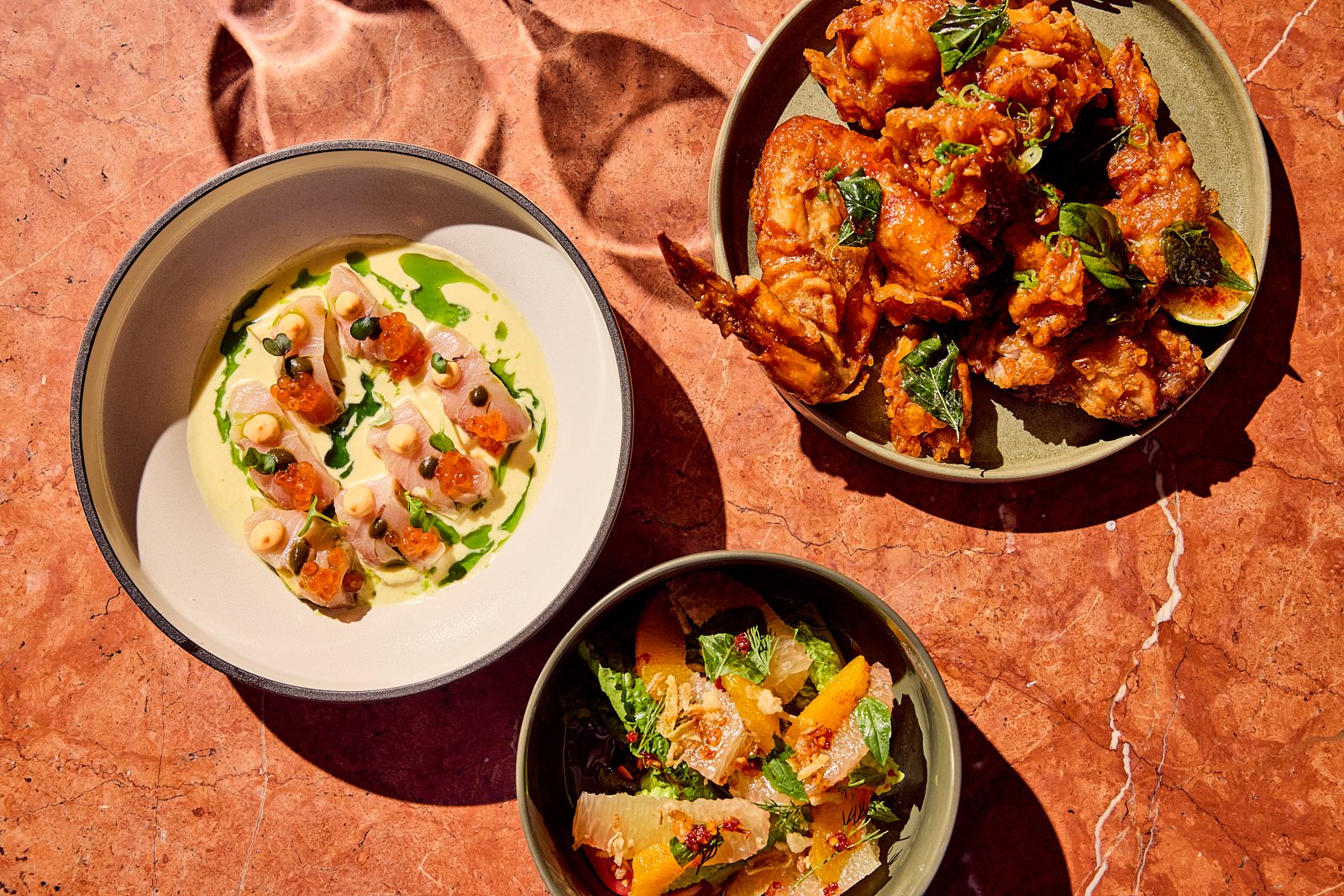Siti dishes, including the chicken wings and crudo, are made to share. Image by Austin-based food photographer, Mackenzie Smith.