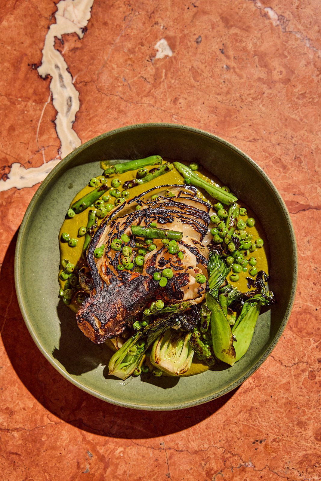 Charred Cabbage with serano curry, charred green beans, bok choy, and nasi satan at Siti. Image by Austin-based food photographer, Mackenzie Smith.