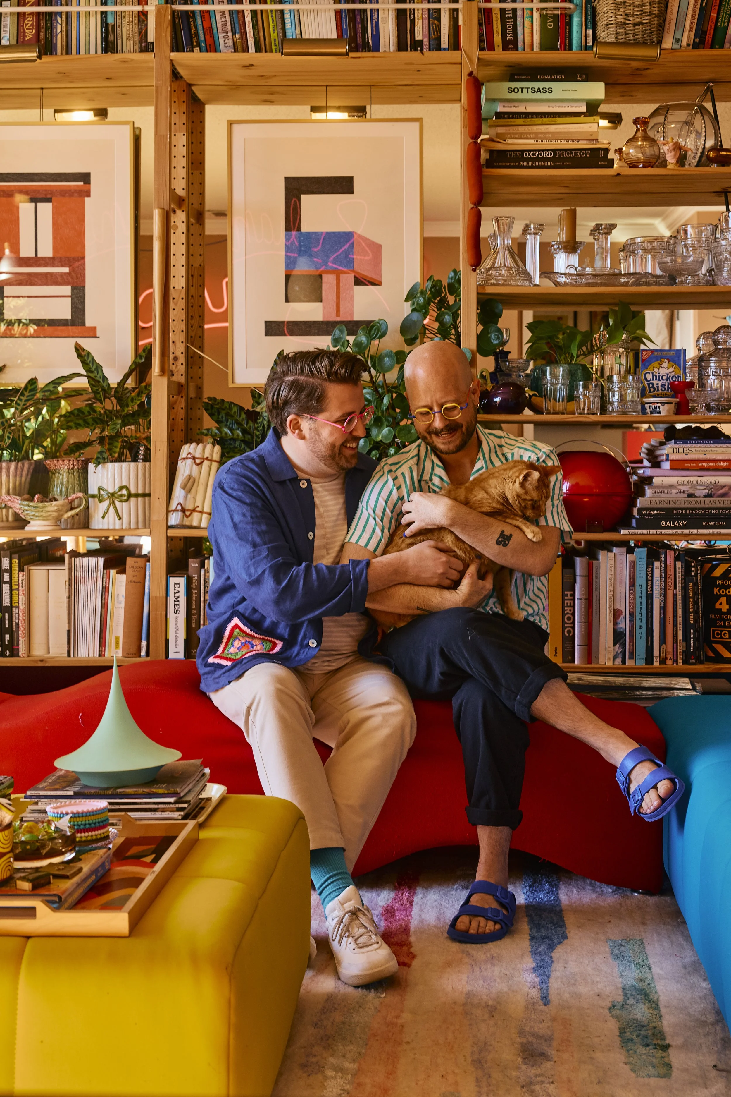 Zach and Taylor with their cat, Stu, in their Houston, TX apartment. Image by Austin-based portrait and lifestyle photographer, Mackenzie Smith.