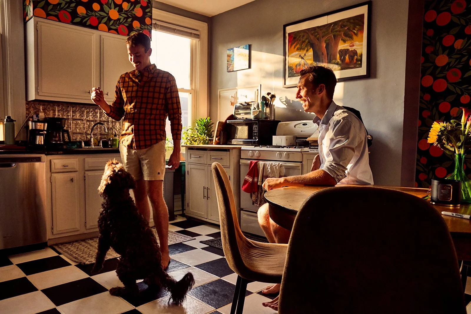 Alex, Bobby and their pup in their kitchen for Apartment Therapy. Image by Austin-based lifestyle photographer, Mackenzie Smith.