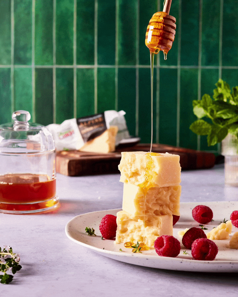 Honey drizzled on cheese for Cabot Creamery. Image and gif created by Austin-based product and lifestyle photographer, Mackenzie Smith. Food styling by Maite Aizpurua.