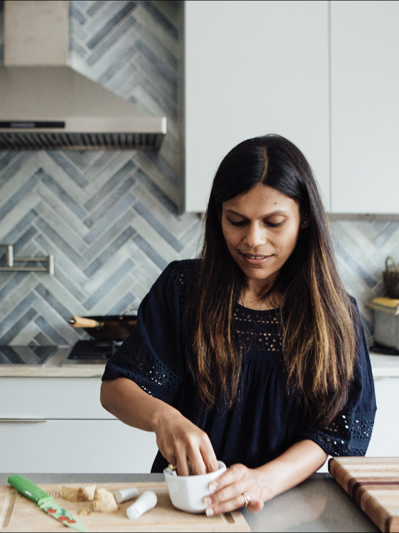 Portrait of Nitya Jain in her kitchen. Image by Austin-based lifestyle photographer, Mackenzie Smith.