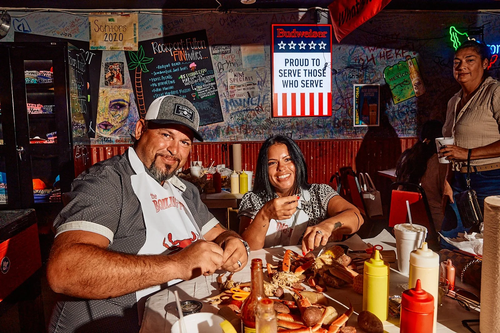 Happy customers at the Boiling Pot in Rockport, TX. Image by Austin-based food and lifestyle photographer, Mackenzie Smith.