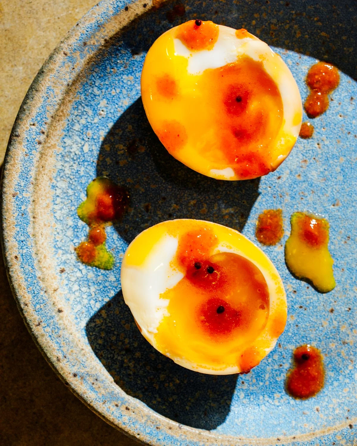 Hardboiled eggs with Brooklyn Delhi chili crisp. Image by Austin-based food photographer, Mackenzie Smith.
