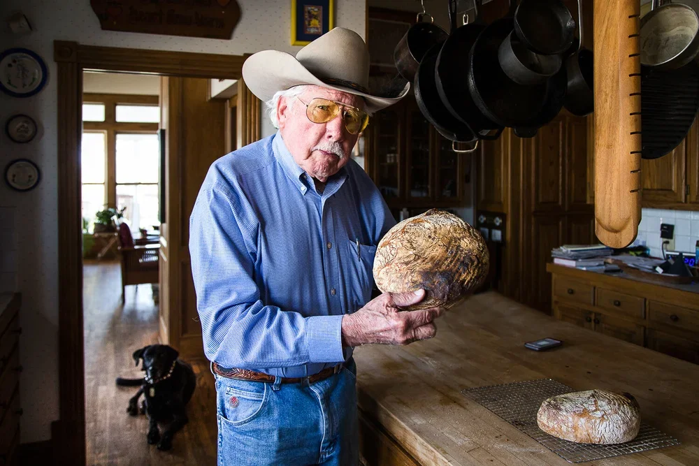 Buzz Hurt and his homemade sourdough bread. Image by Austin-based food and portrait photographer, Mackenzie Smith.