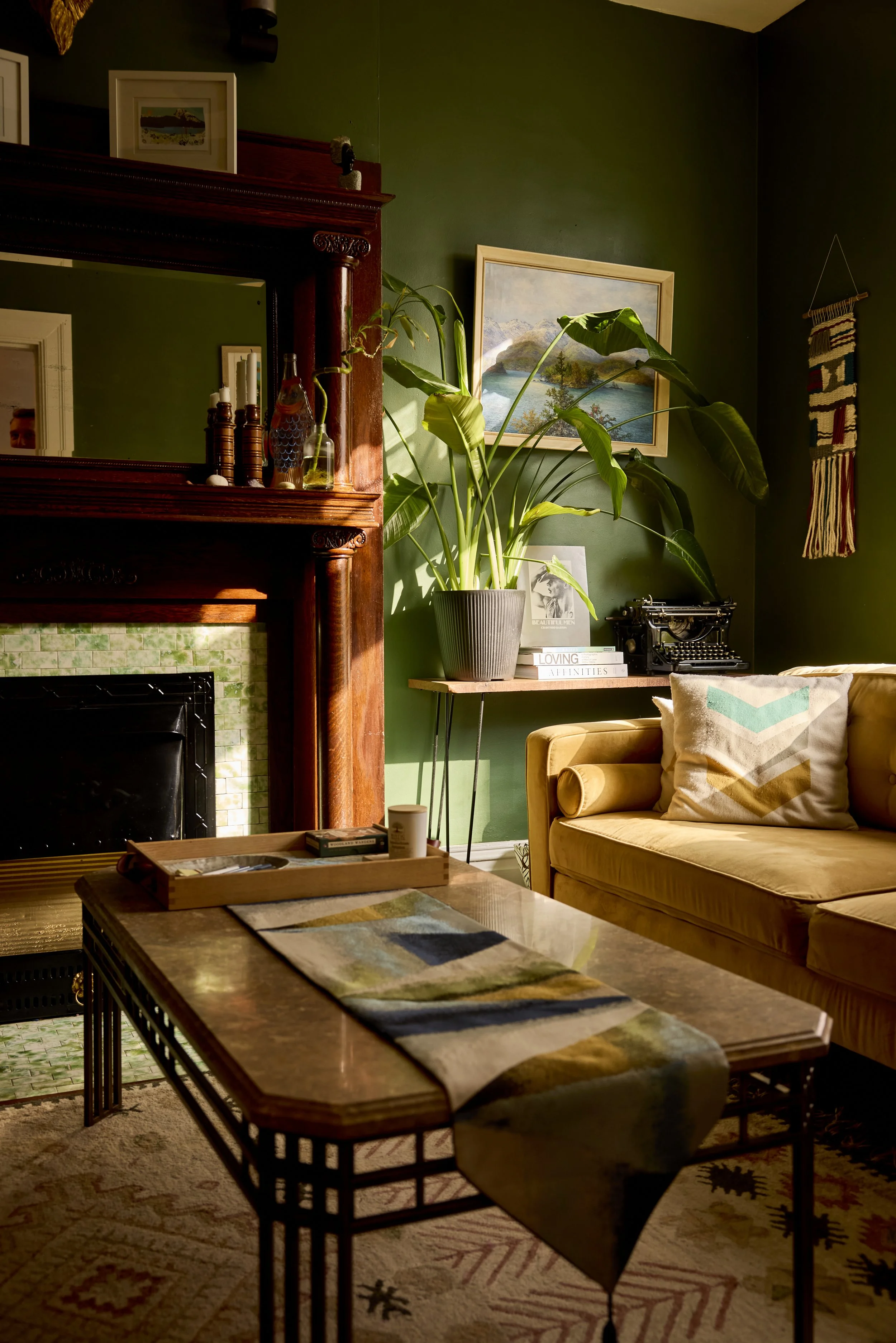 Living room with a fireplace with custom built two-shelf mantlepiece. Image by Austin-based lifestyle photographer, Mackenzie Smith.