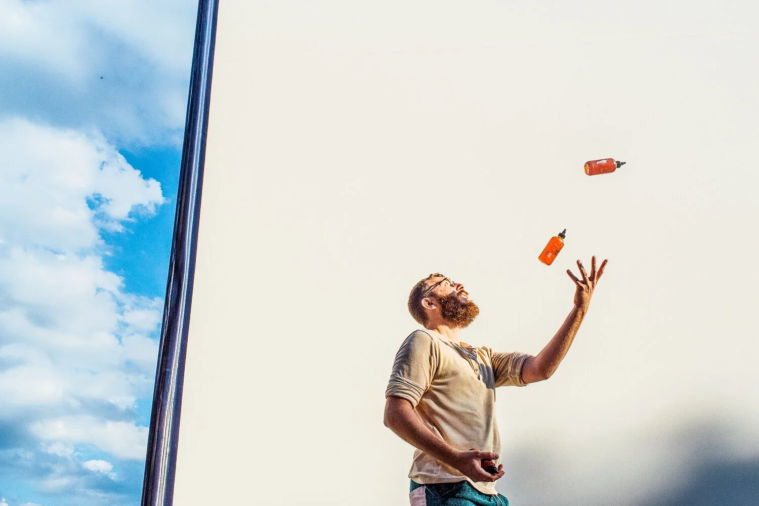 Juggling sriracha bottles. Image by Austin-based food and product photographer, Mackenzie Smith.