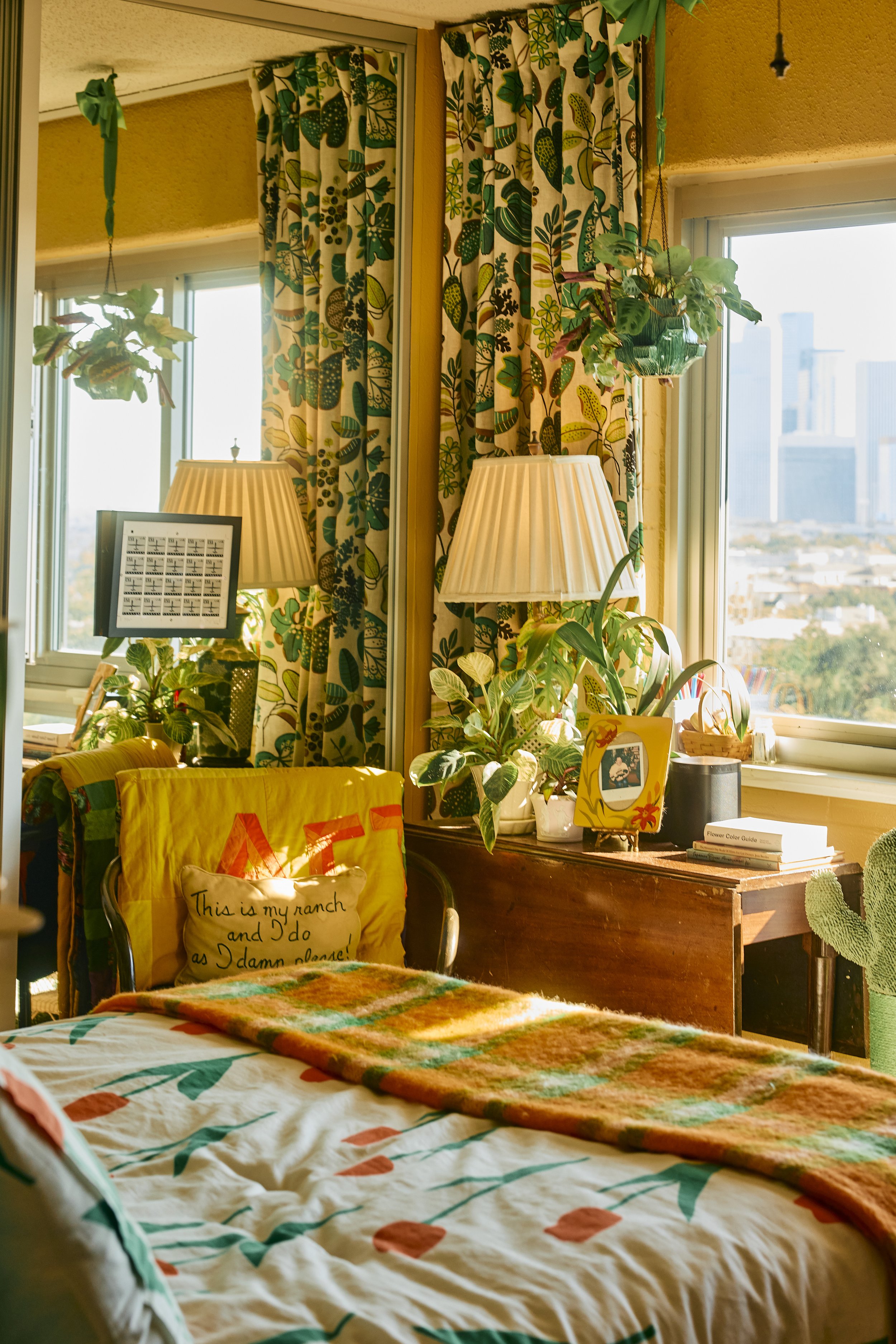Cozy and bright bedroom with a view of the Houston, TX skyline. Image by Austin-based lifestyle photographer, Mackenzie Smith.